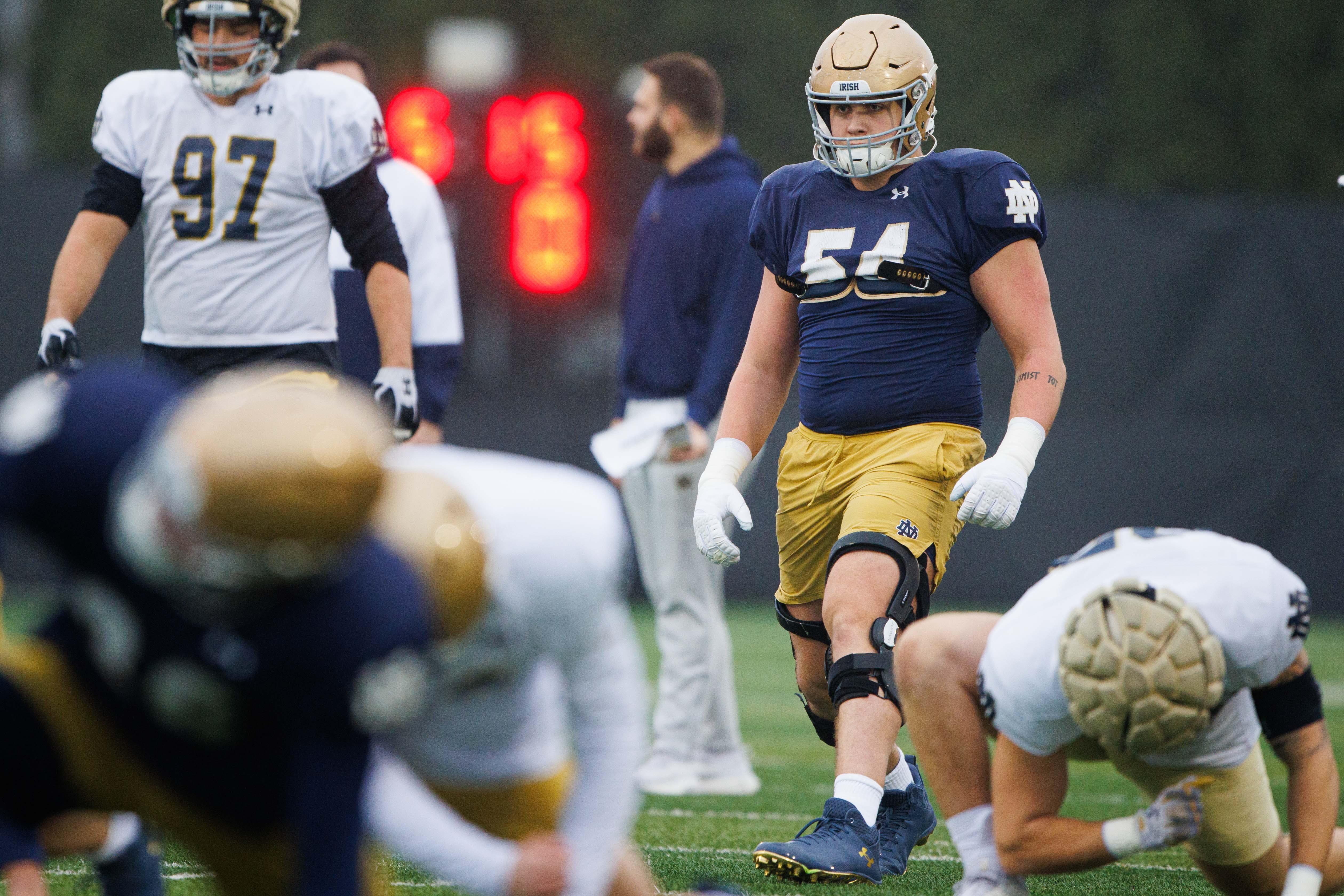 Notre Dame offensive lineman Anthonie Knapp (54) warms up during a Notre Dame football practice at Irish Athletic Center on Monday, Dec. 16, 2024, in South Bend.