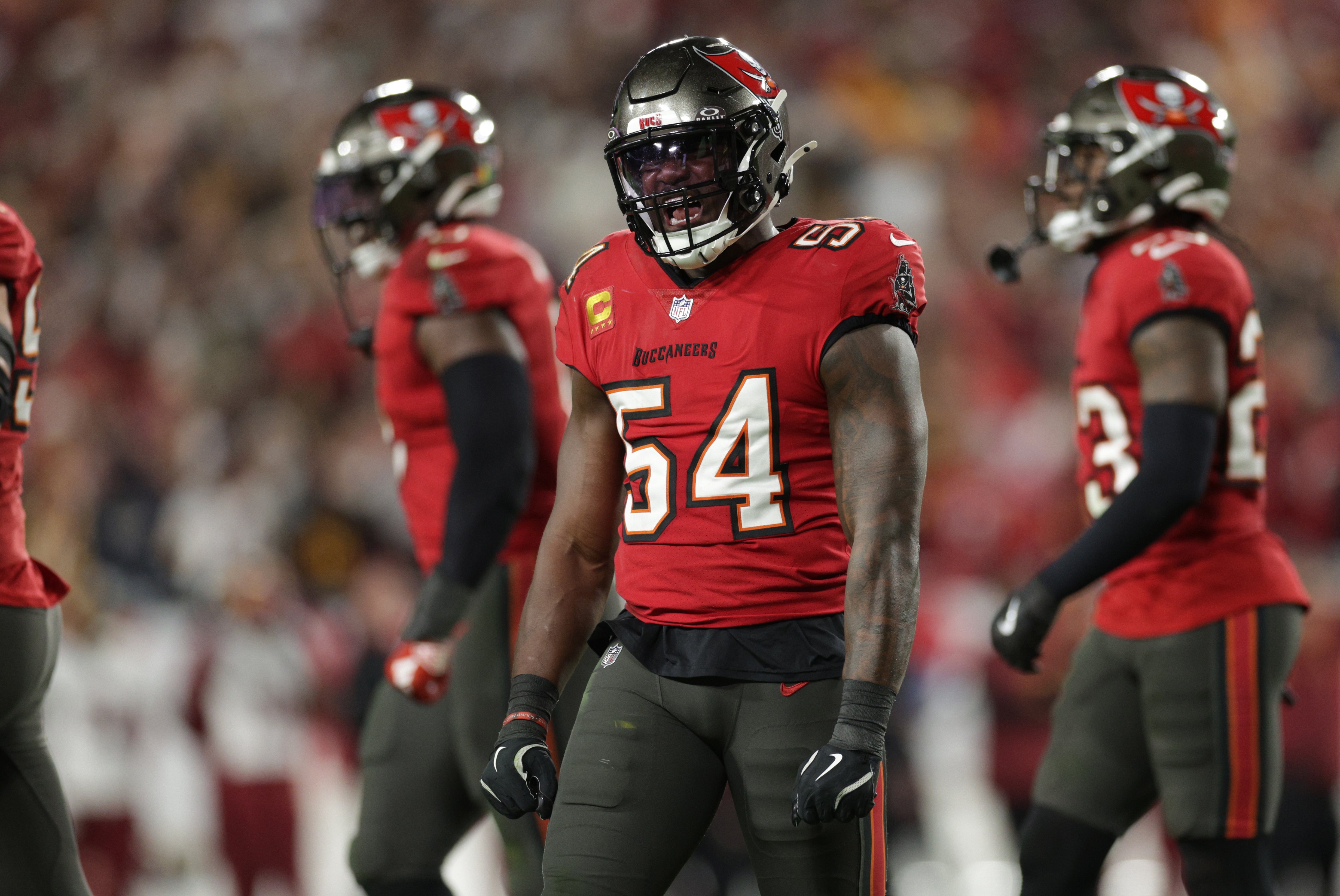 Jan 12, 2025; Tampa, Florida, USA; Tampa Bay Buccaneers linebacker Lavonte David (54) celebrates after a stop during the fourth quarter of a NFC wild card playoff against the Washington Commanders at Raymond James Stadium.
