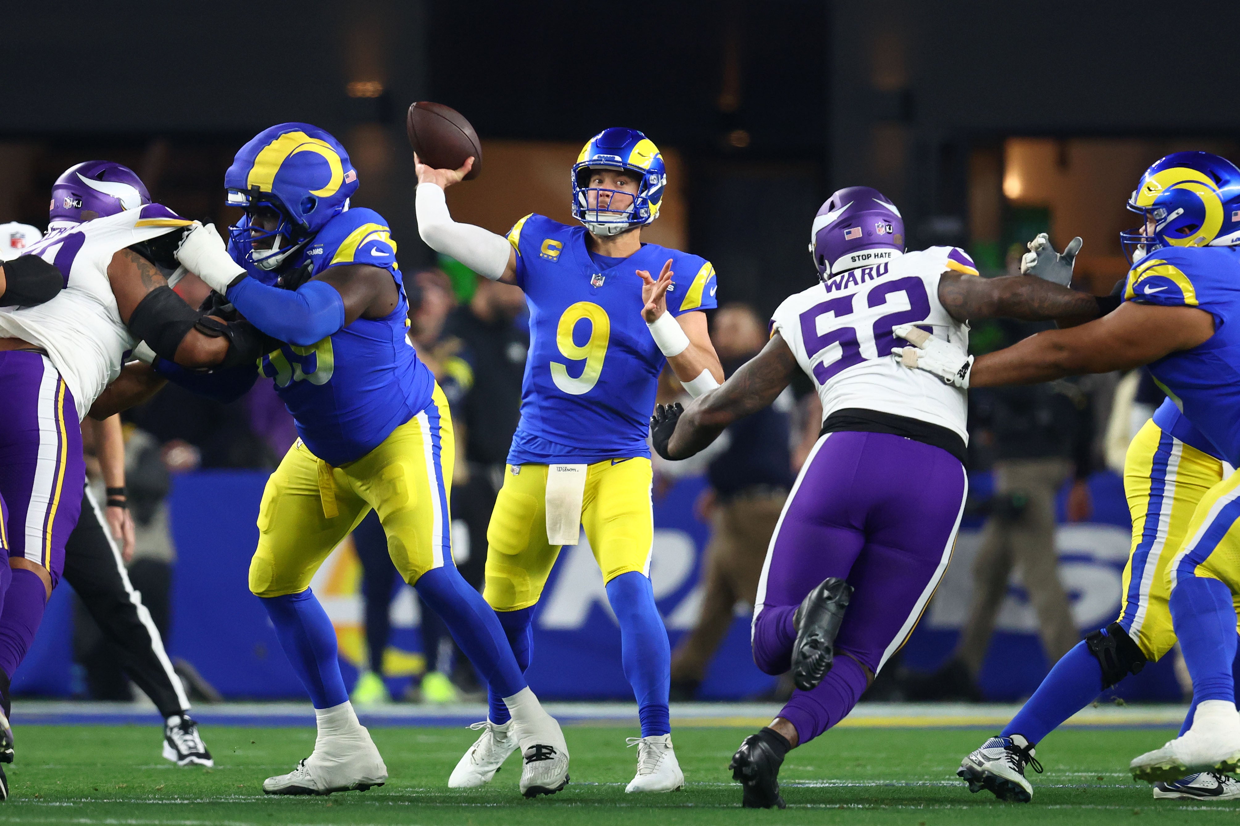 Jan 13, 2025; Glendale, AZ, USA; Los Angeles Rams quarterback Matthew Stafford (9) drops back to pass against the Minnesota Vikings during the first half in an NFC wild card game at State Farm Stadium.