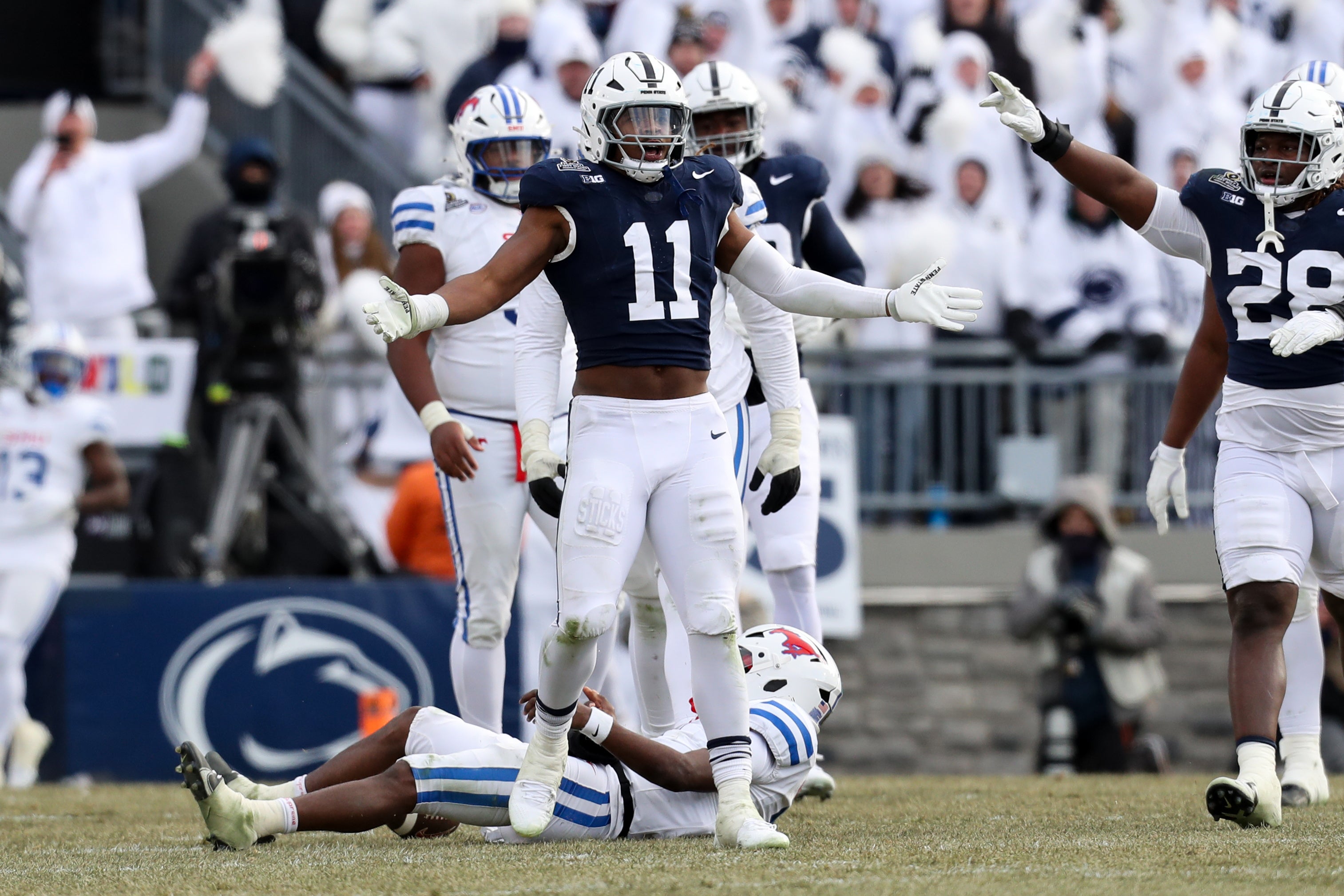 Penn State Nittany Lions defensive end Abdul Carter (11) reacts after sacking Southern Methodist Mustangs quarterback Kevin Jennings (7) during the third quarter in the first round of the College Football Playoff at Beaver Stadium.