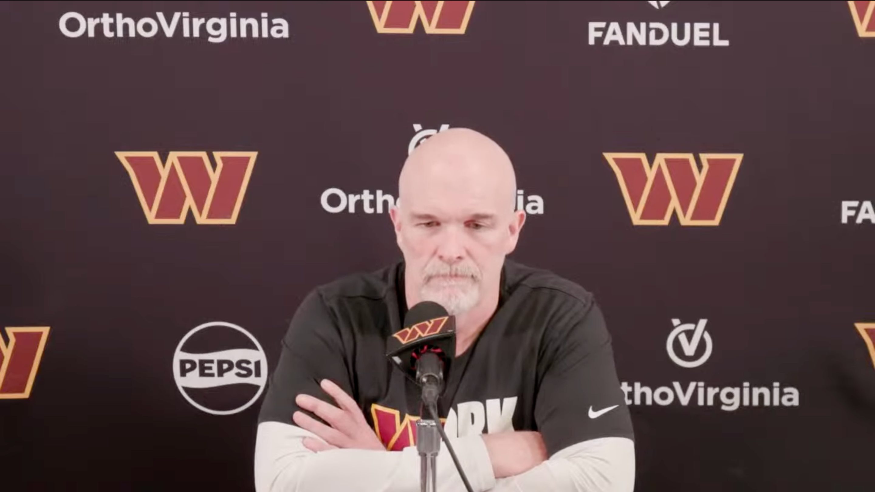 Dan Quinn talks to reporters the Monday after the Commanders' playoff win over the Bucs.