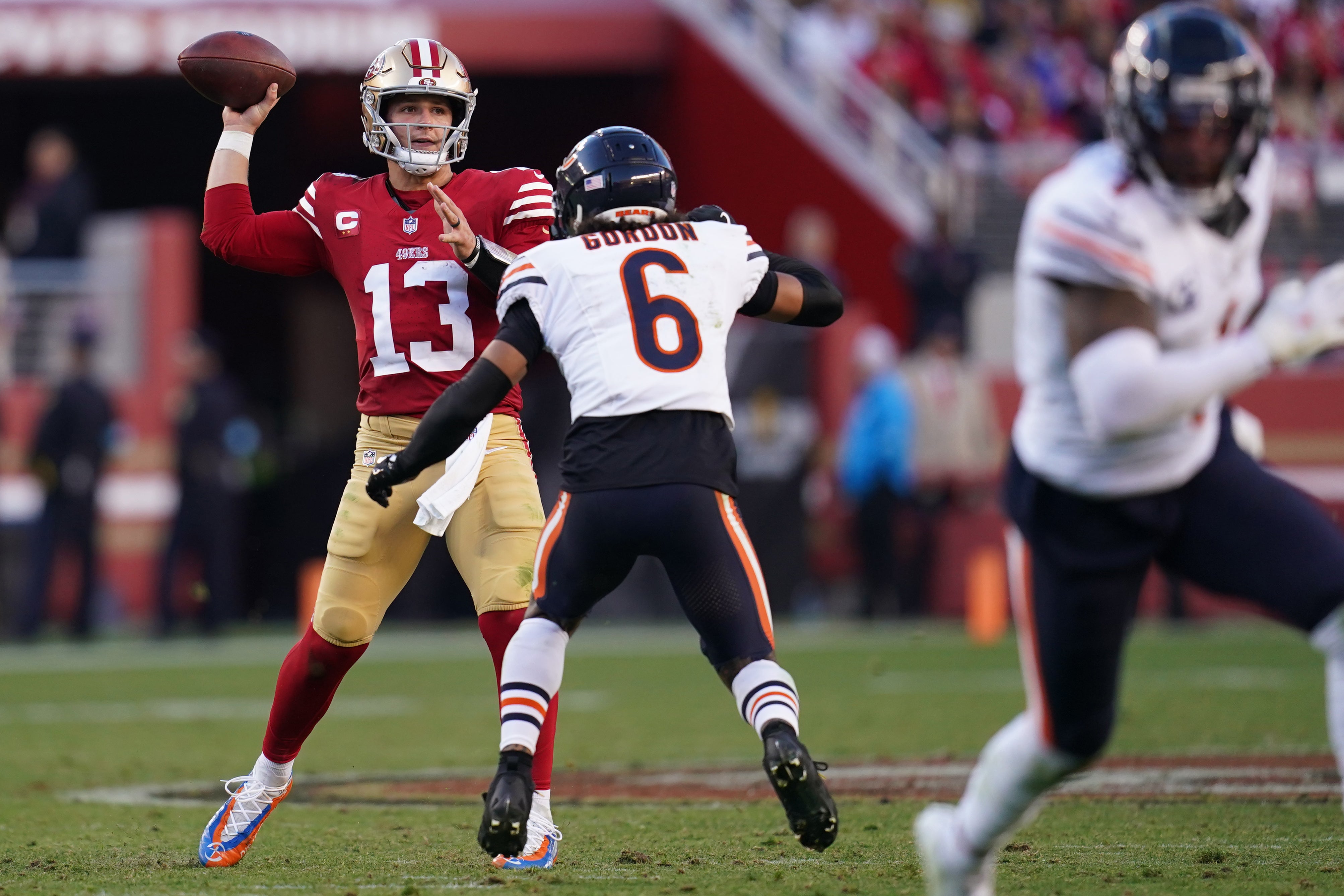 Dec 8, 2024; Santa Clara, California, USA; San Francisco 49ers quarterback Brock Purdy (13) throws a pass next to Chicago Bears cornerback Kyler Gordon (6) in the fourth quarter at Levi's Stadium.