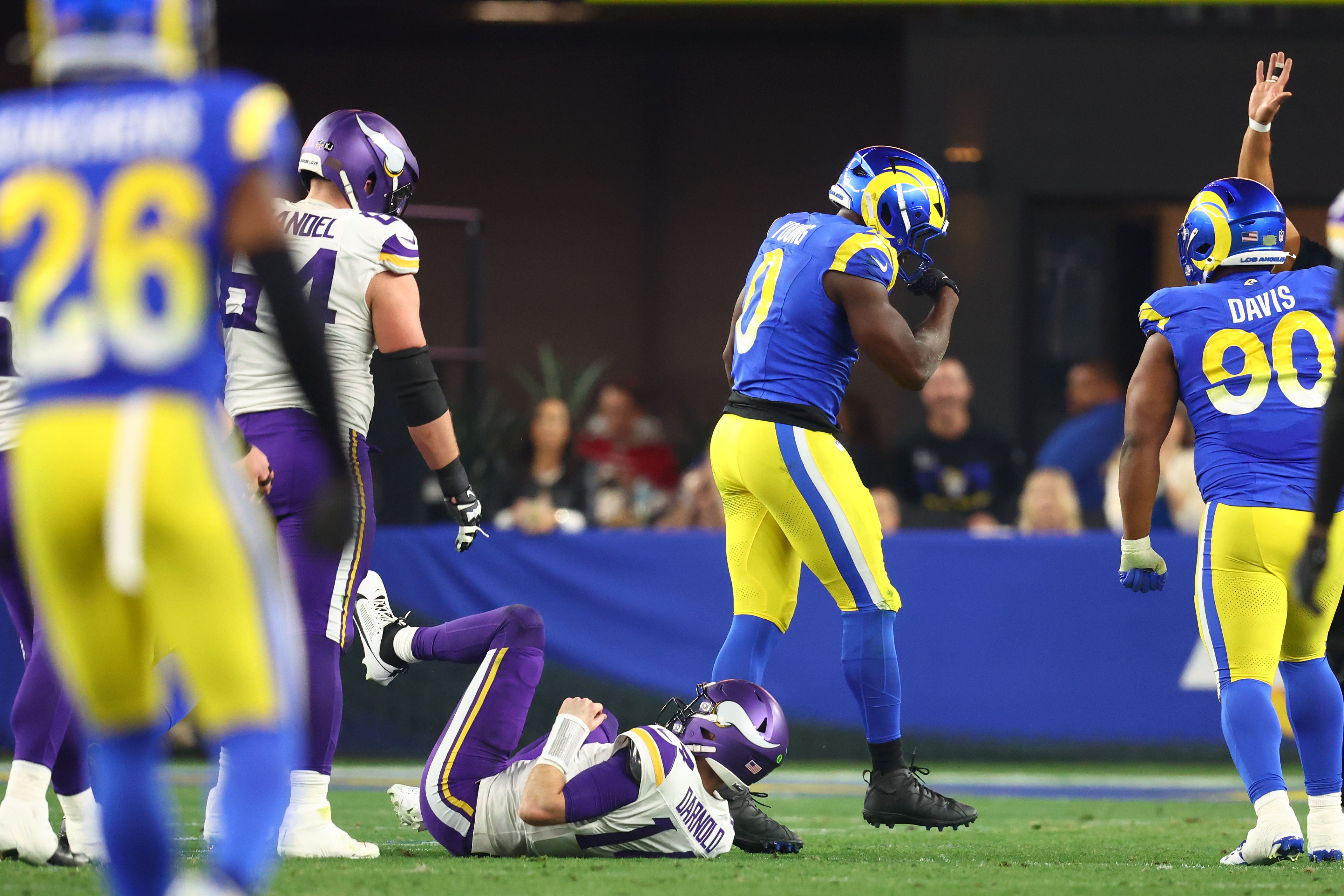 Jan 13, 2025; Glendale, AZ, USA; Los Angeles Rams linebacker Byron Young (0) reacts after a sack on Minnesota Vikings quarterback Sam Darnold (14) during the first half in an NFC wild card game at State Farm Stadium.