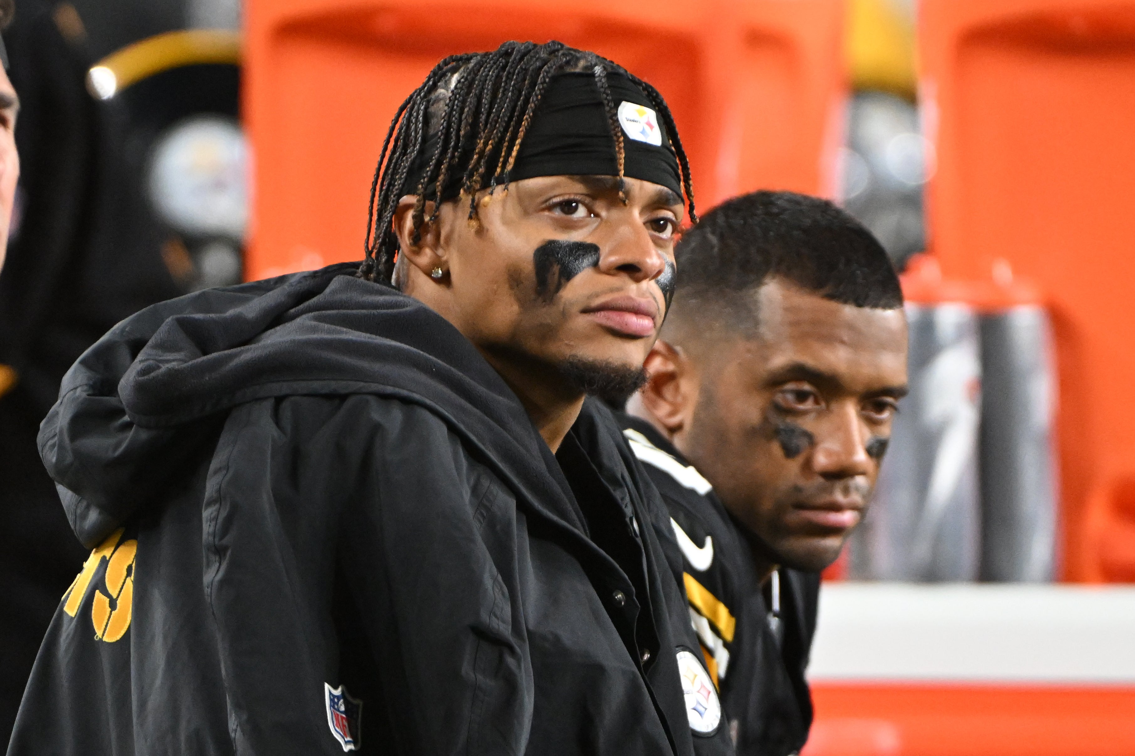 Oct 20, 2024; Pittsburgh, Pennsylvania, USA; Pittsburgh Steelers quarterbacks Justin Fields (2) and Russell Wilson (3) watch the action against the New York Jets during the fourth quarter at Acrisure Stadium.
