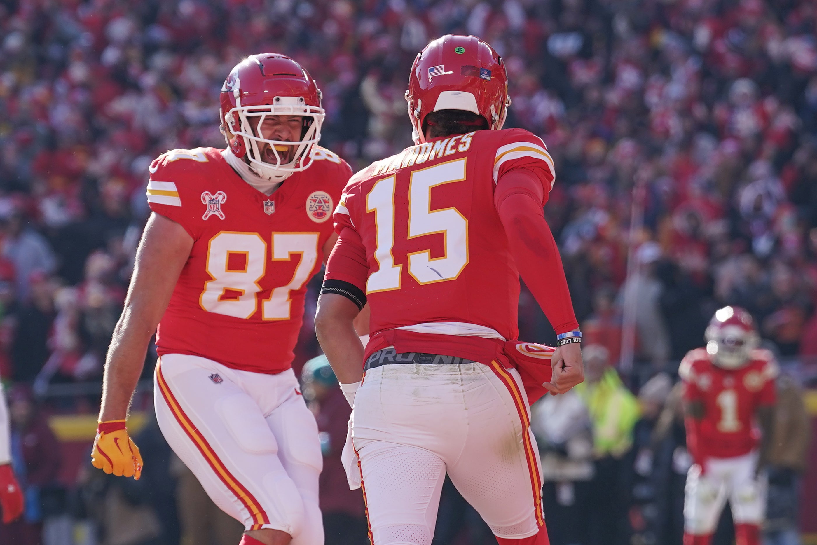Dec 21, 2024; Kansas City, Missouri, USA; Kansas City Chiefs tight end Travis Kelce (87) celebrates with quarterback Patrick Mahomes (15) after Mahomes’ touchdown against the Houston Texans during the first half at GEHA Field at Arrowhead