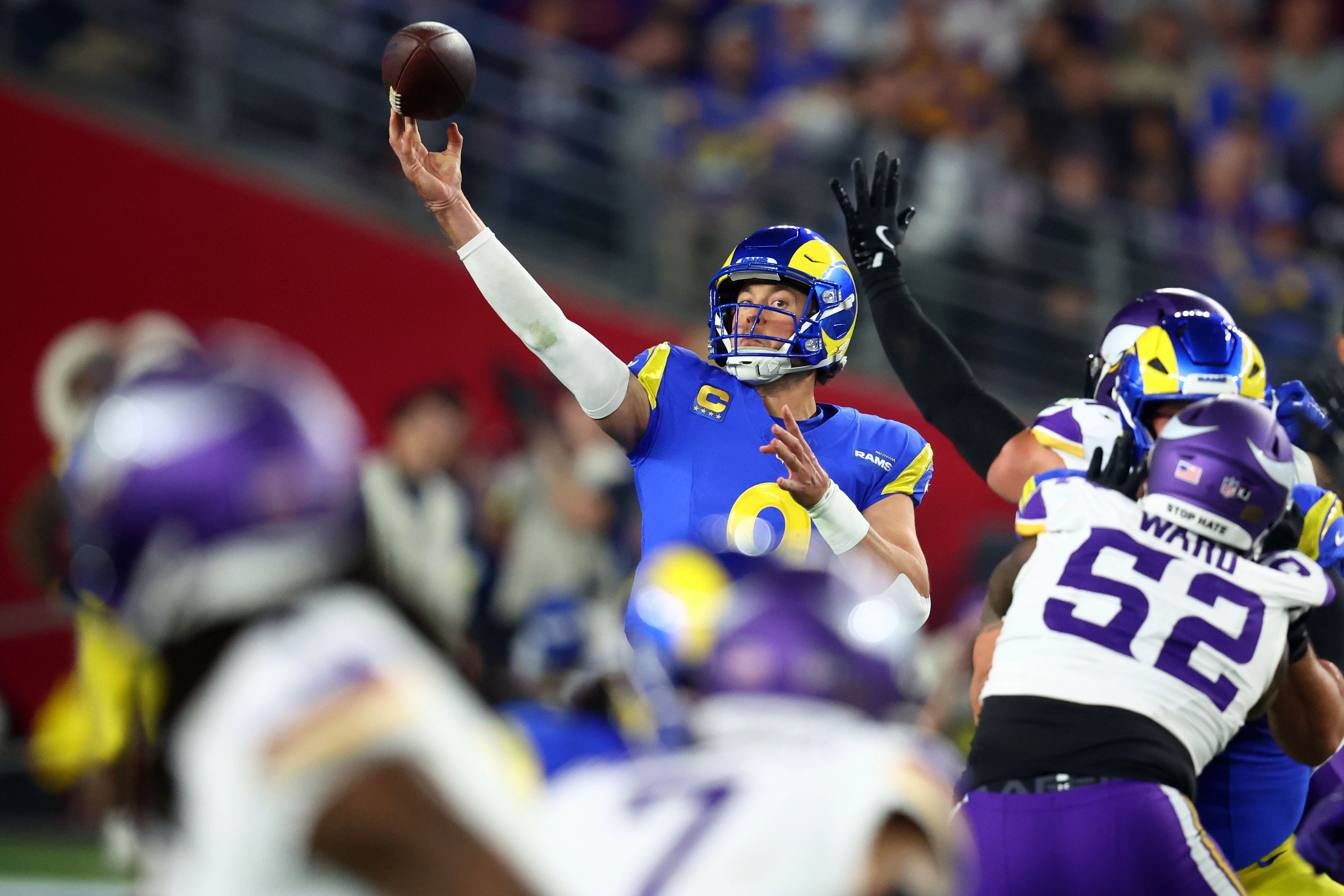 Los Angeles Rams quarterback Matthew Stafford (9) drops back to pass against the Minnesota Vikings during the second half in an NFC wild card game at State Farm Stadium.