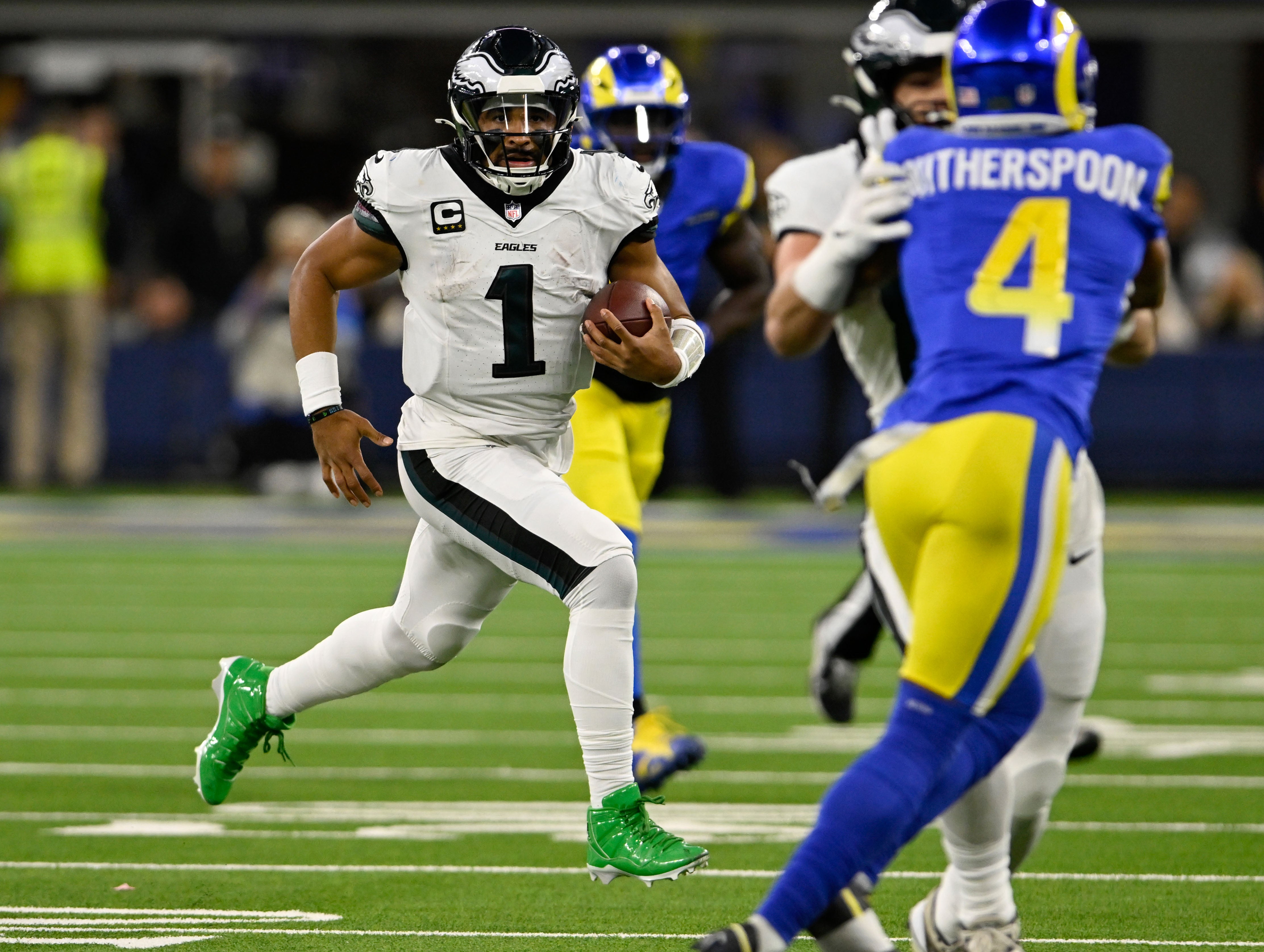 Philadelphia Eagles quarterback Jalen Hurts (1) scrambles against the Los Angeles Rams during the second half at SoFi Stadium.