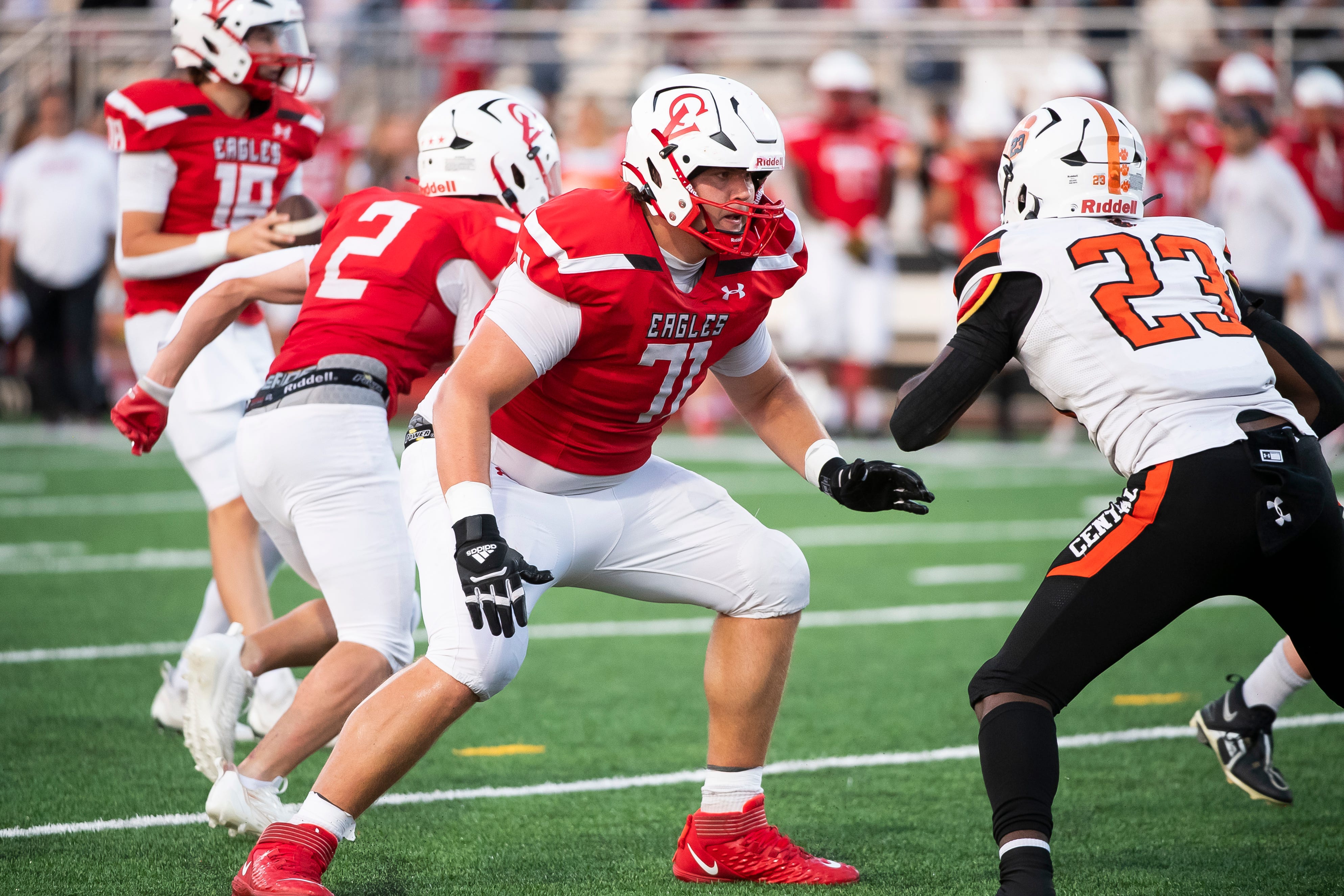 Cumberland Valley offensive lineman Tyler Merrill (71) prepares to block Central York's Malachi Ramnath (23) during a pass play at Chapman Field August 26, 2023, in Mechanicsburg.