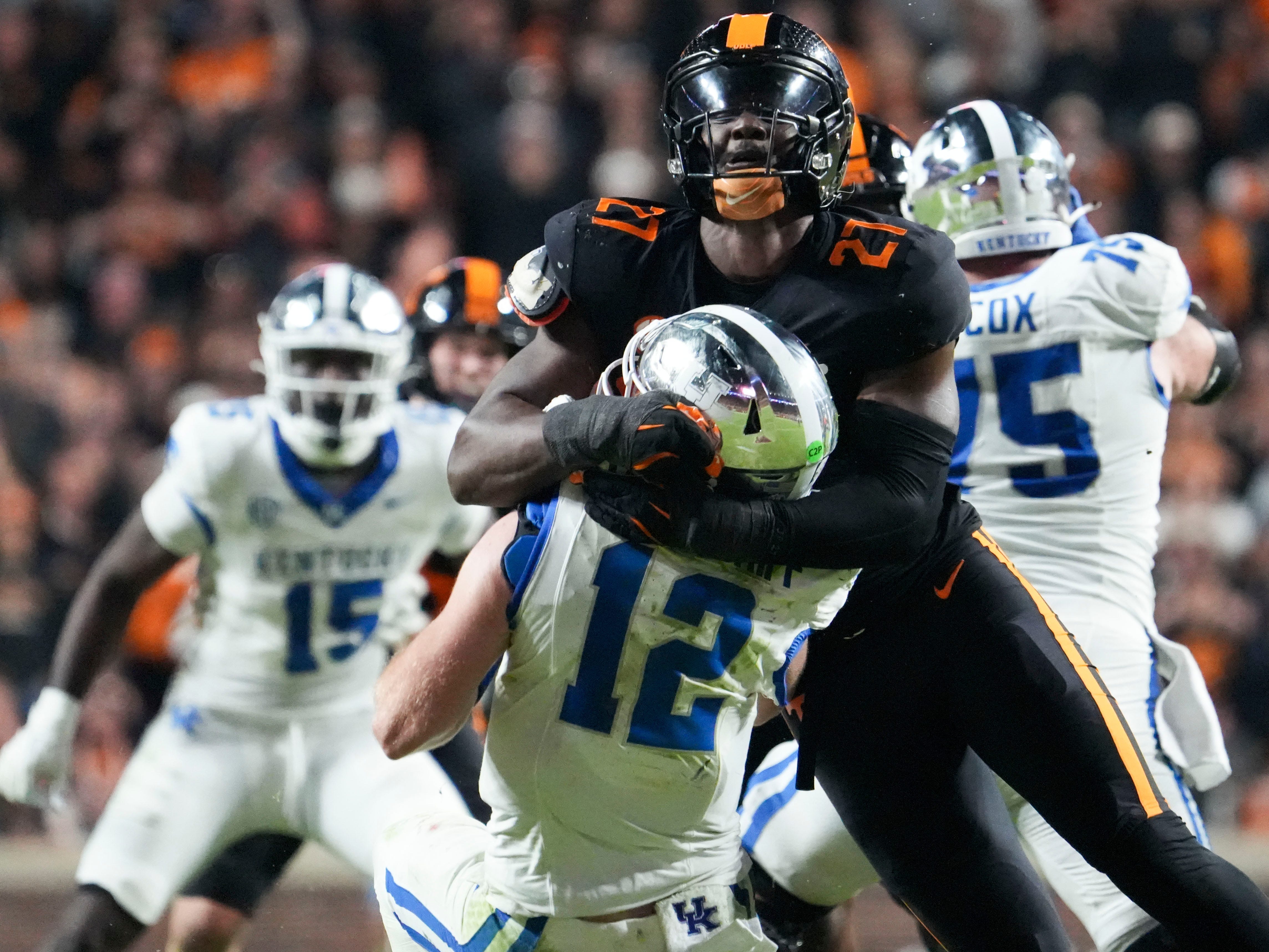 Tennessee defensive lineman James Pearce Jr. (27) takes down Kentucky quarterback Brock Vandagriff (12) during an NCAA college football game between Tennessee and Kentucky on Saturday, Nov. 2, 2024, in Knoxville, Tenn.