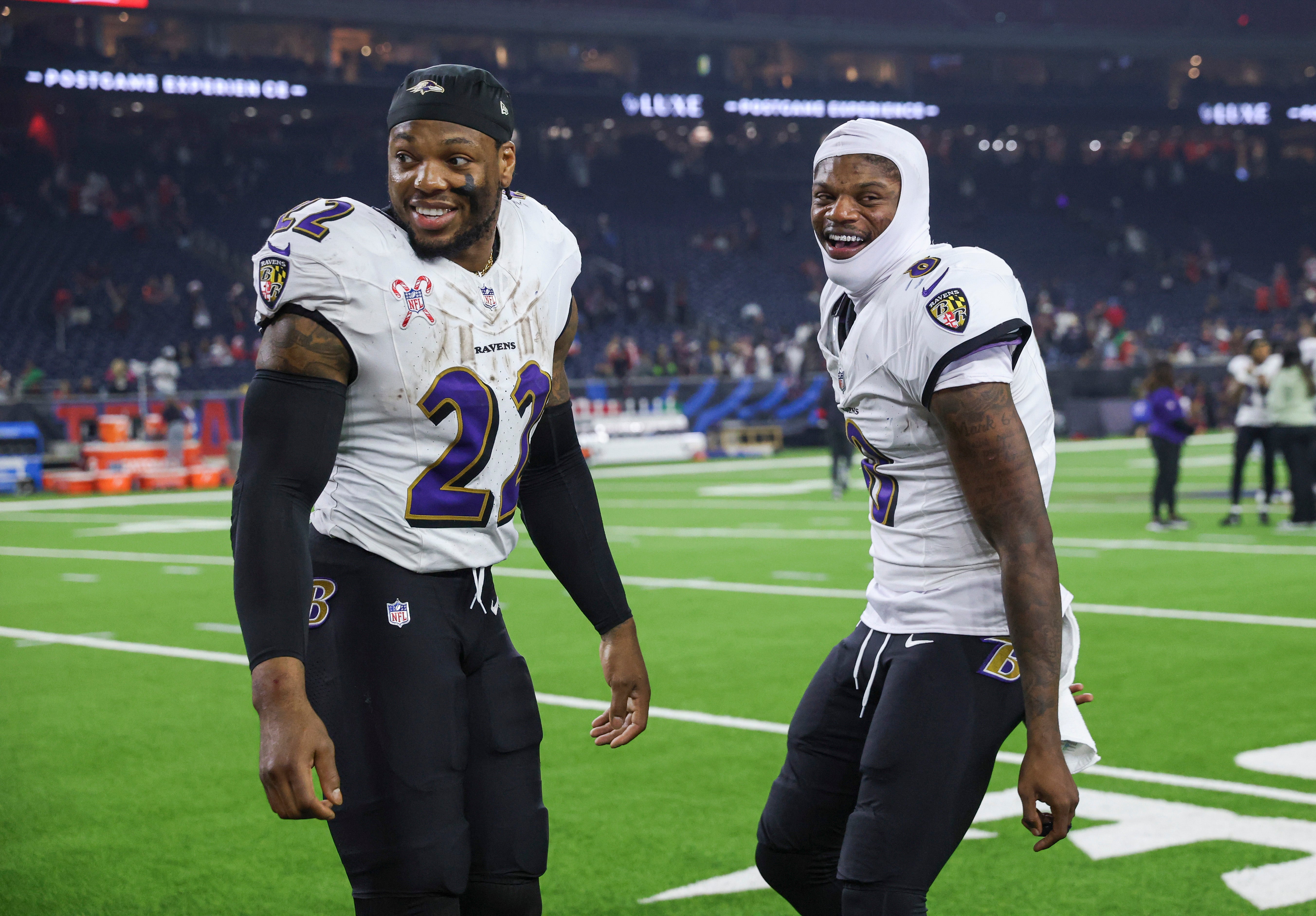Dec 25, 2024; Houston, Texas, USA; Baltimore Ravens running back Derrick Henry (22) and quarterback Lamar Jackson (8) smile after the game against the Houston Texans at NRG Stadium.
