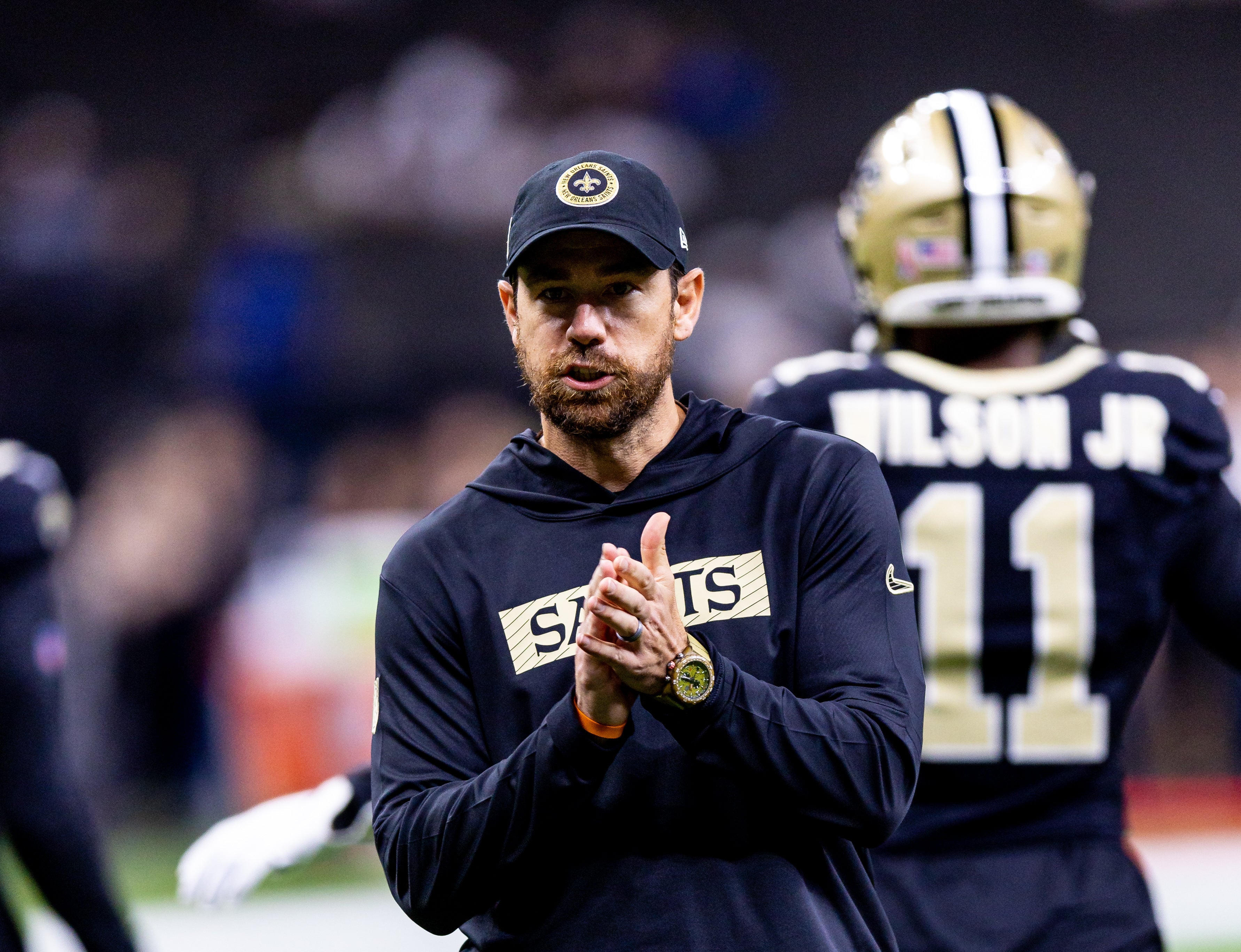New Orleans Saints offensive coordinator Klint Kubiak reacts against the Carolina Panthers during the pregame at Caesars Superdome.