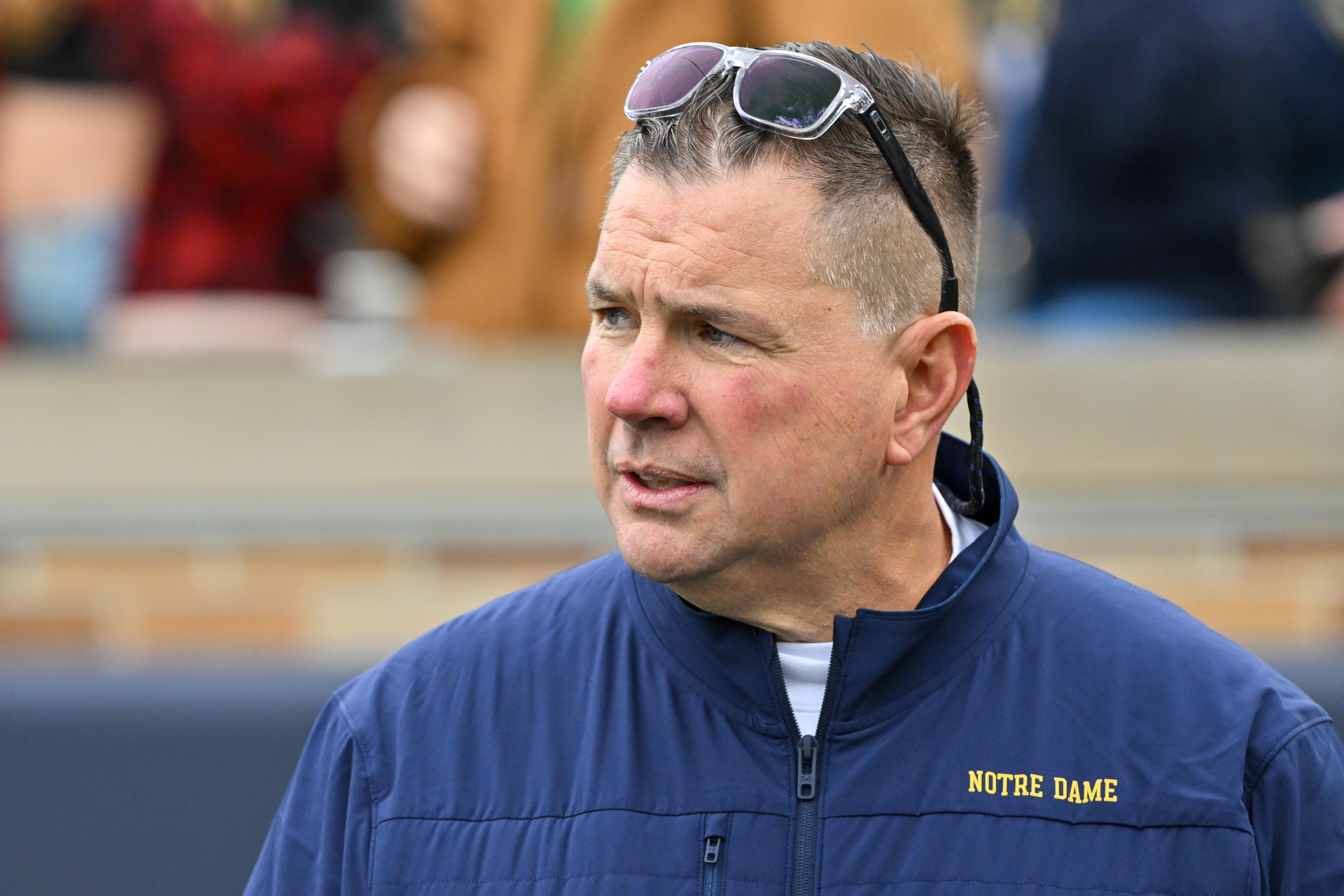 Notre Dame Fighting Irish defensive coordinator Al Golden watches warmups before a game against the Virginia Cavaliers at Notre Dame Stadium.