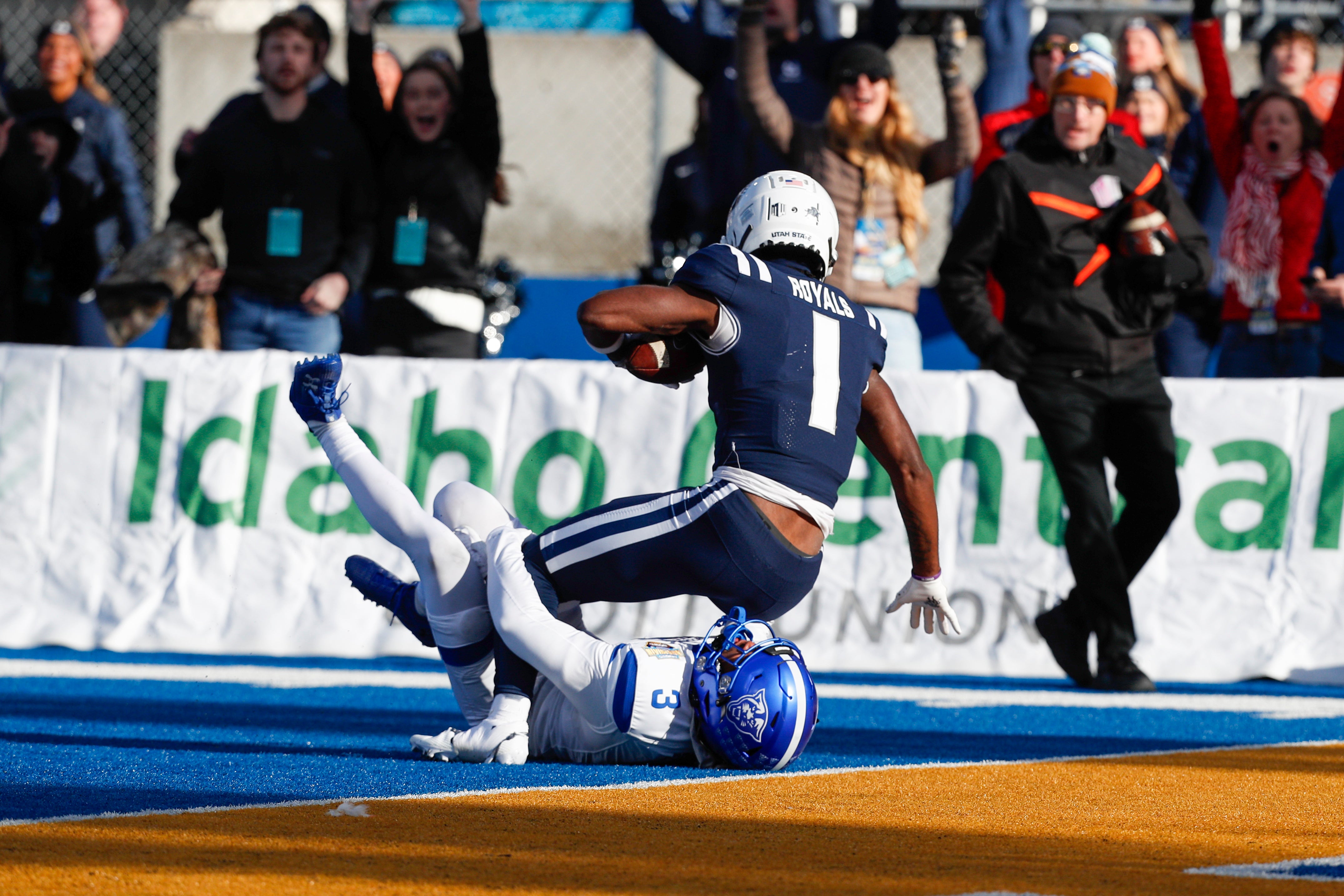 Utah State Aggies wide receiver Jalen Royals (1) scores a touchdown during the first half against the Georgia State Panthers at Albertsons Stadium.