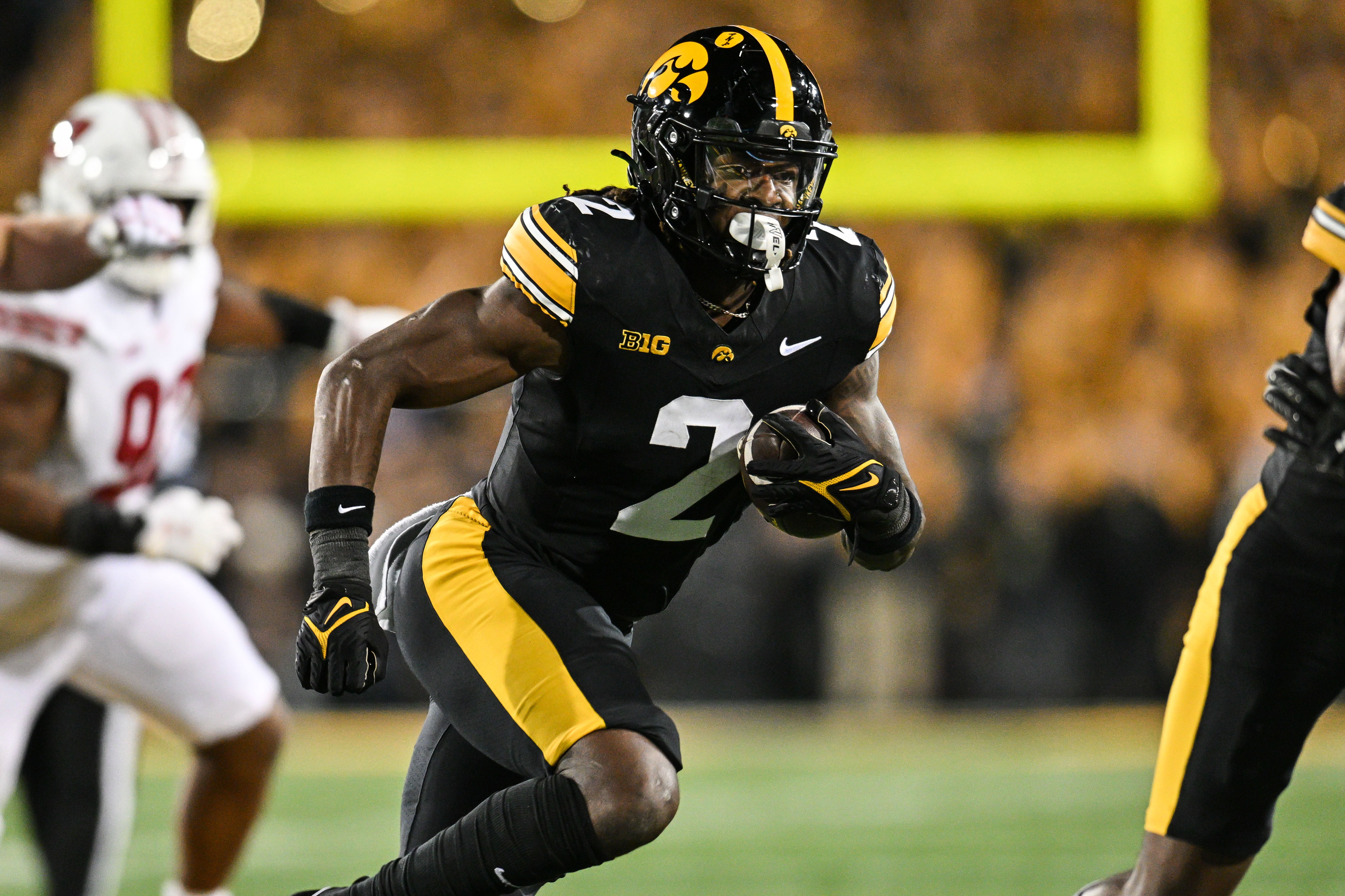 Nov 2, 2024; Iowa City, Iowa, USA; Iowa Hawkeyes running back Kaleb Johnson (2) runs the ball against the Wisconsin Badgers during the second quarter at Kinnick Stadium.