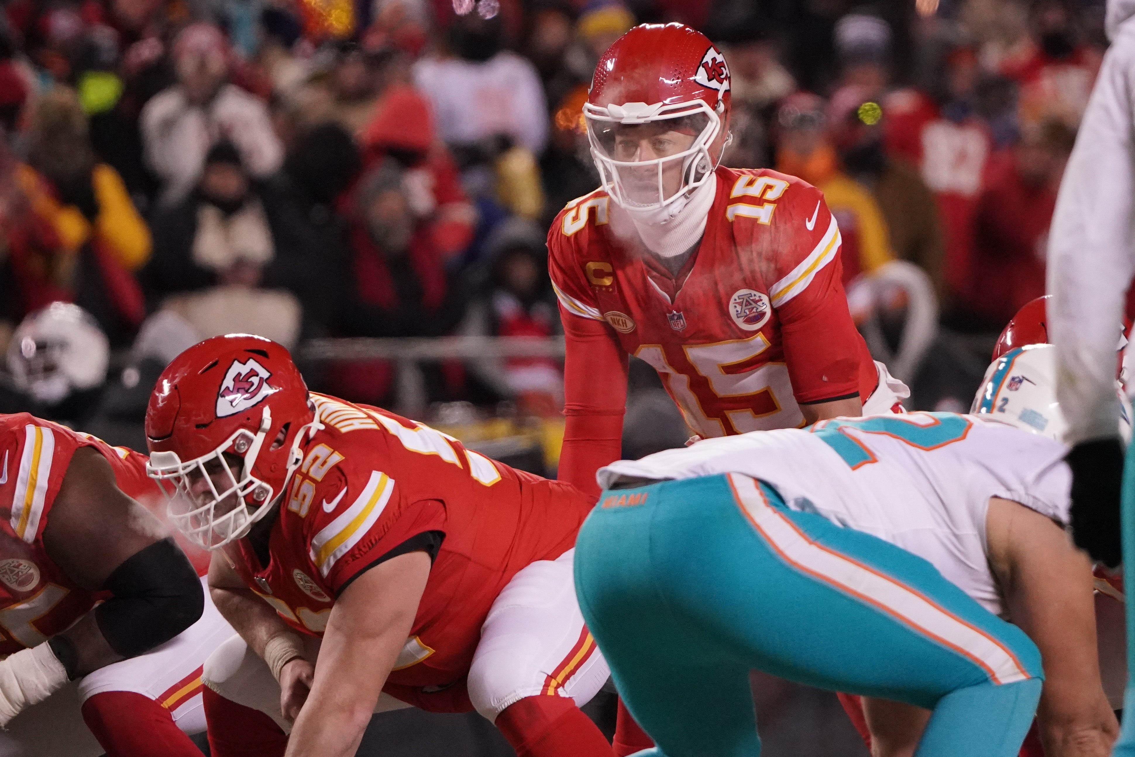 Jan 13, 2024; Kansas City, Missouri, USA; Kansas City Chiefs quarterback Patrick Mahomes (15) before taking the snap against the Miami Dolphins during the second half of the 2024 AFC wild card game at GEHA Field at Arrowhead Stadium.