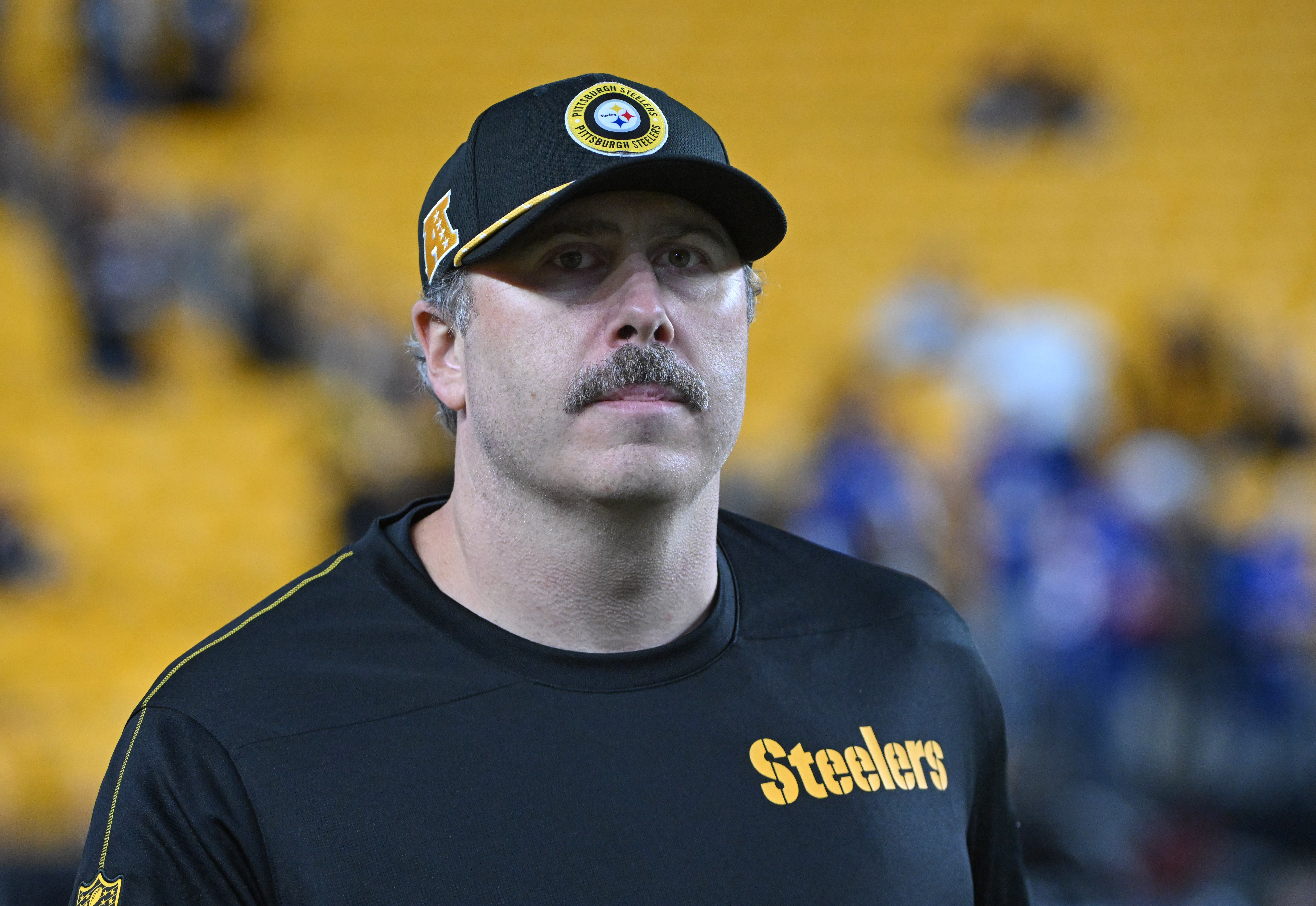 Pittsburgh Steelers offensive coordinator Arthur Smith walks the sidelines during warmup for a game against the New York Giants at Acrisure Stadium.