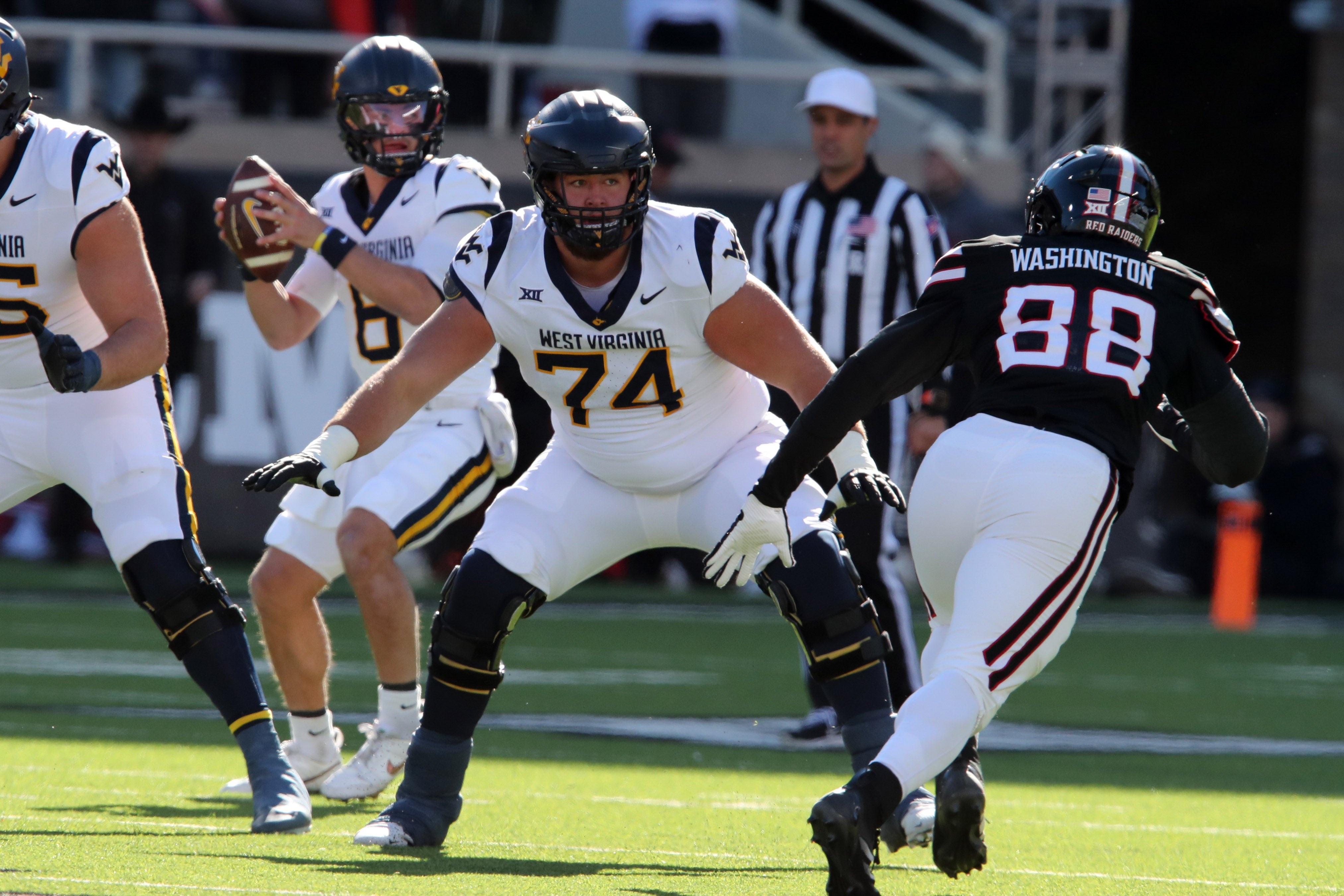 West Virginia Mountaineers offensive lineman Wyatt Milum (74) prepares to block Texas Tech Red Raiders back Amier Washington (88) in the first half at Jones AT&T Stadium and Cody Campbell Field.