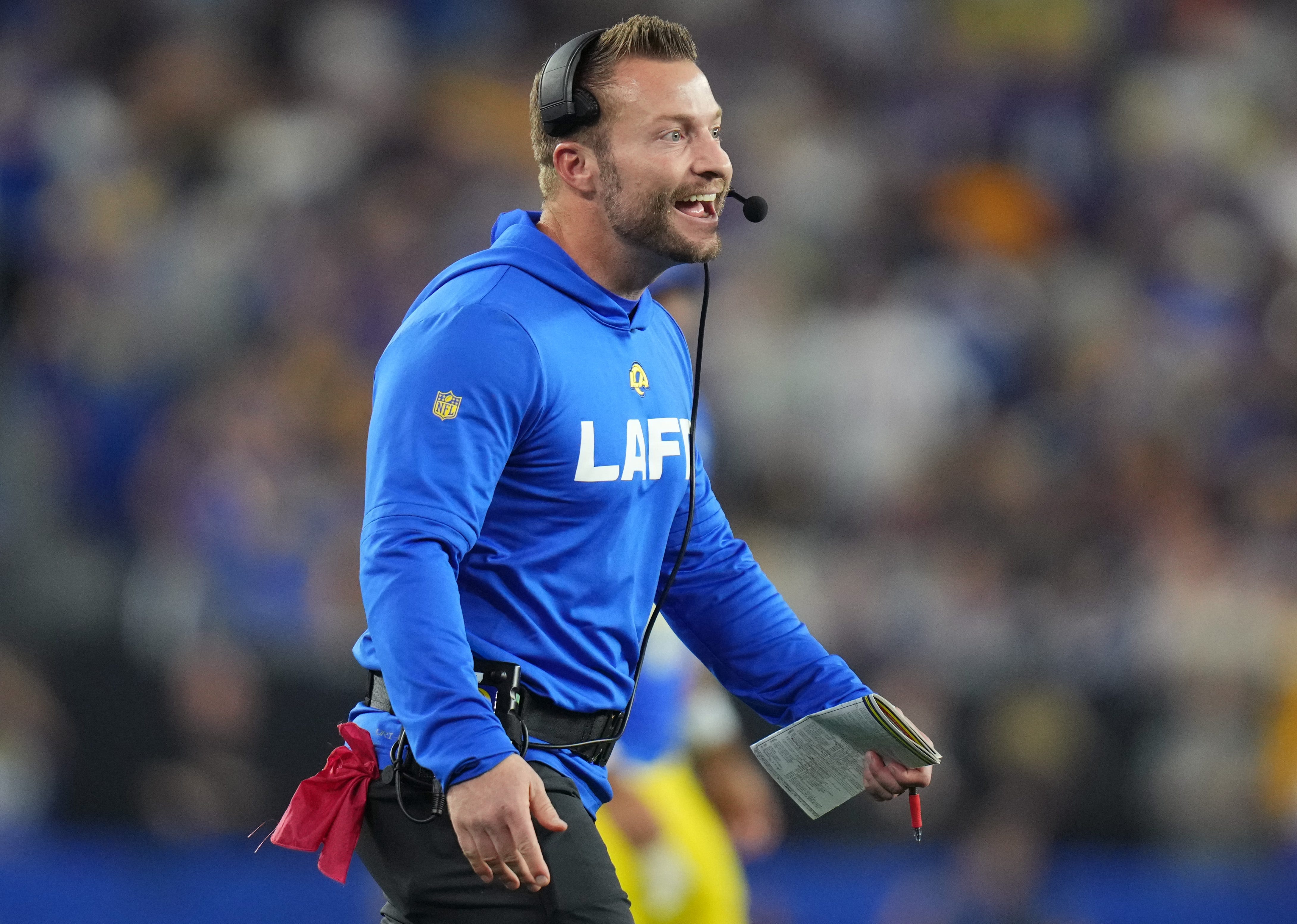 Los Angeles Rams head coach Sean McVay smiles after his team scores a touchdown against the Minnesota Vikings during their playoff game at State Farm Stadium on Jan. 13, 2025, in Glendale.