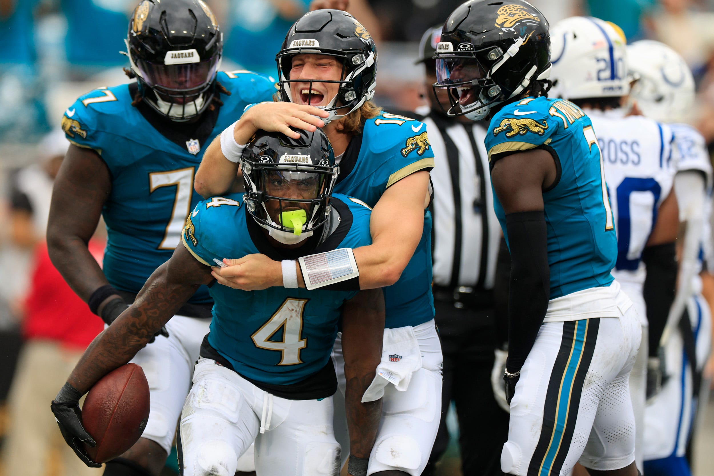 Jacksonville Jaguars quarterback Trevor Lawrence (16) celebrates a touchdown scored by running back Tank Bigsby (4) during the third quarter of NFL football matchup Sunday, Oct. 6, 2024 at EverBank Stadium in Jacksonville, Fla. The Jaguars edged the Colts on a field goal 37-34.