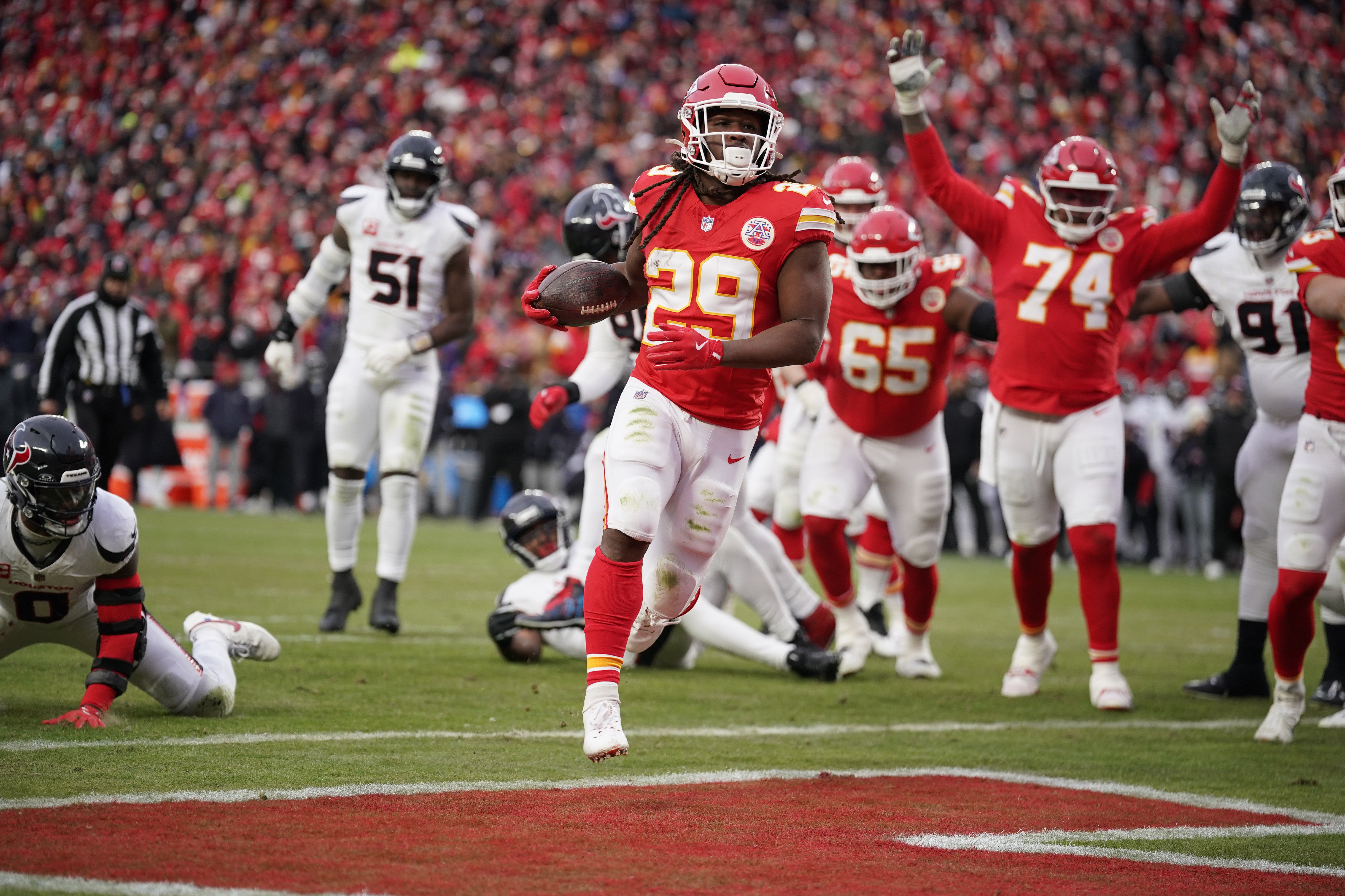 Jan 18, 2025; Kansas City, Missouri, USA; Kansas City Chiefs running back Kareem Hunt (29) carries the ball for a touchdown against the Houston Texans during the second quarter of a 2025 AFC divisional round game at GEHA Field at Arrowhead Stadium.