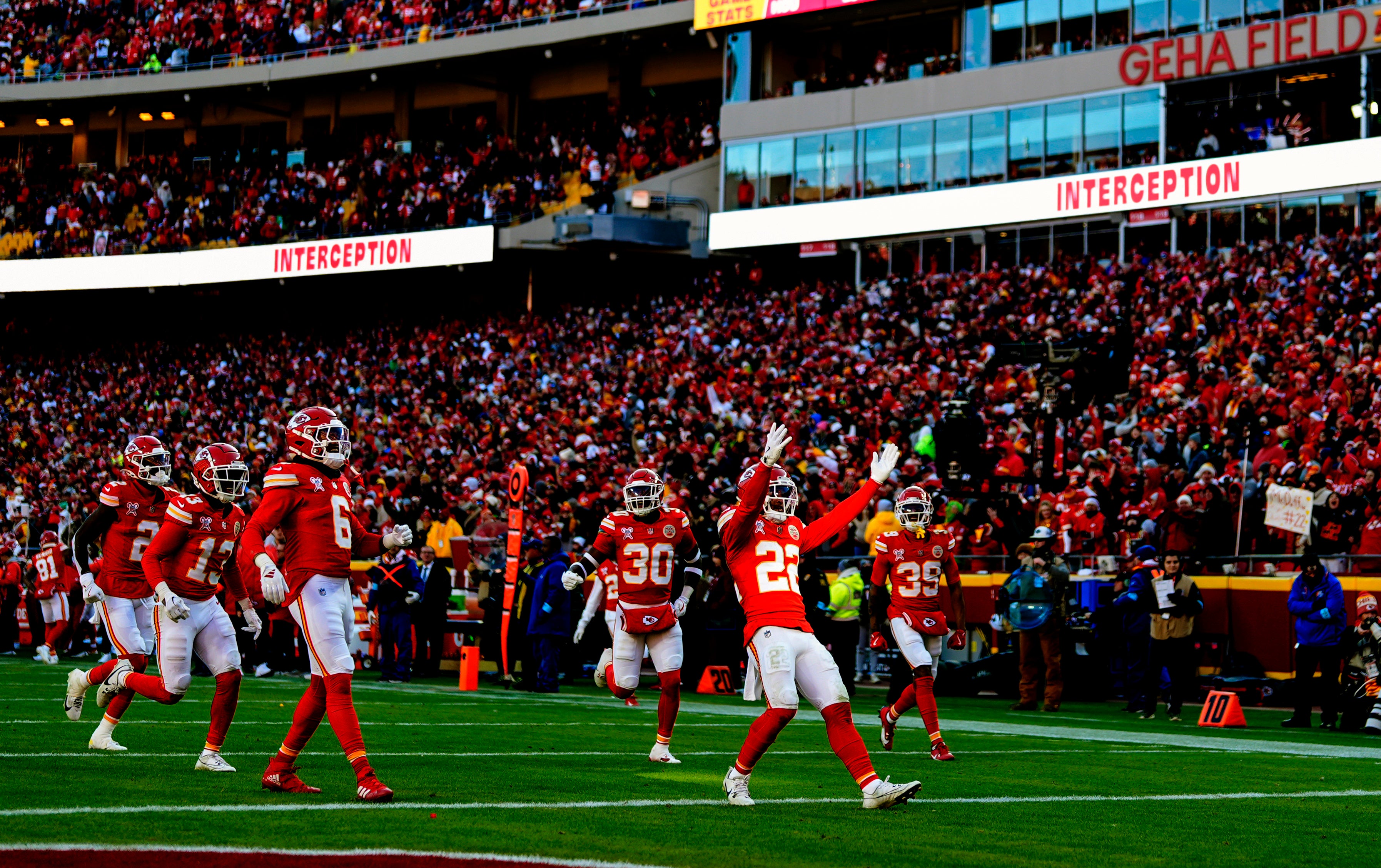 Chiefs cornerback Trent McDuffie (22) celebrates with teammates after an interception during the first half against the Texans.