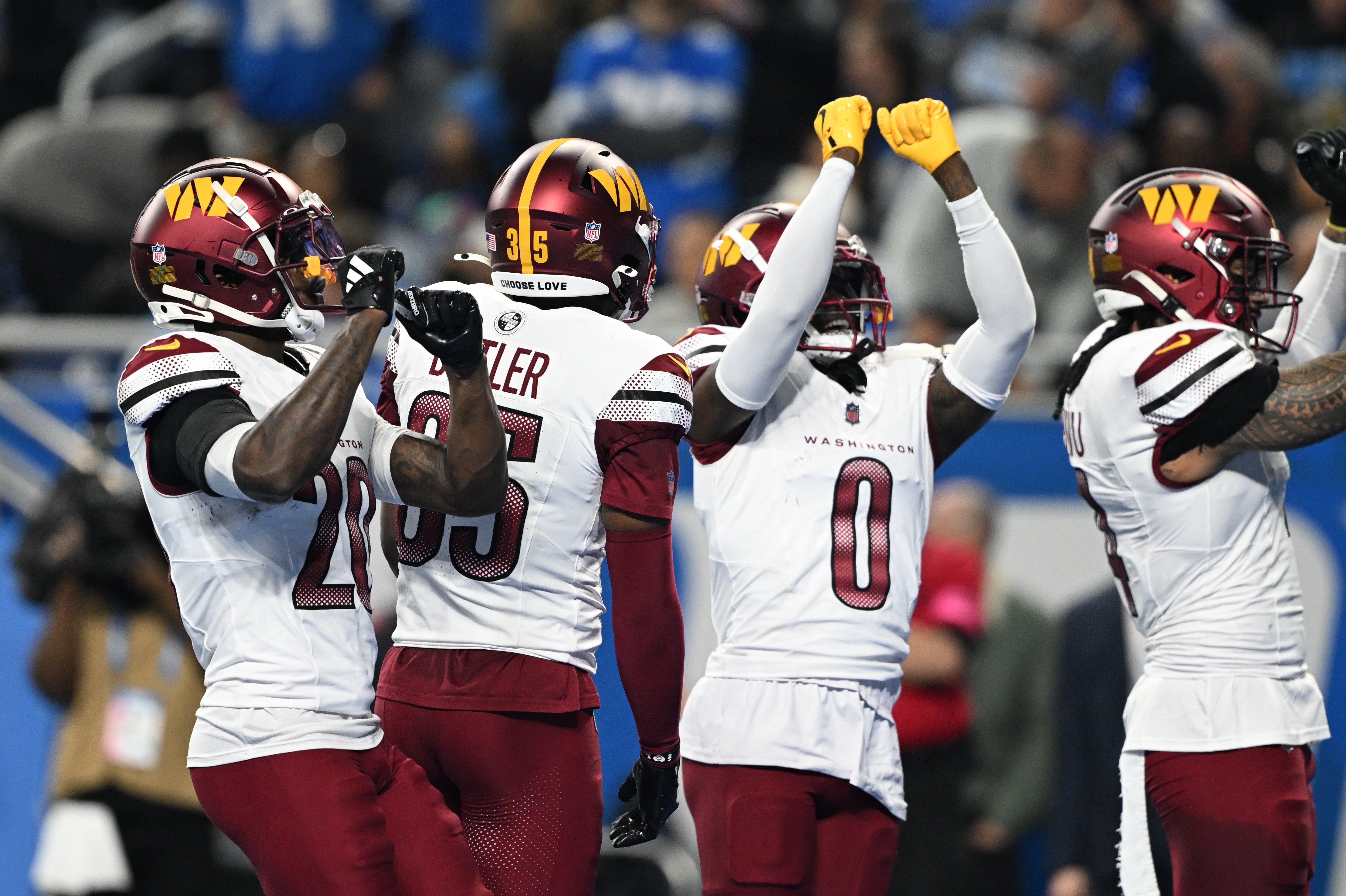Jan 18, 2025; Detroit, Michigan, USA; Washington Commanders corner back Mike Sainristil (0) celebrates an interception against Detroit Lions during the second quarter in a 2025 NFC divisional round game at Ford Field.