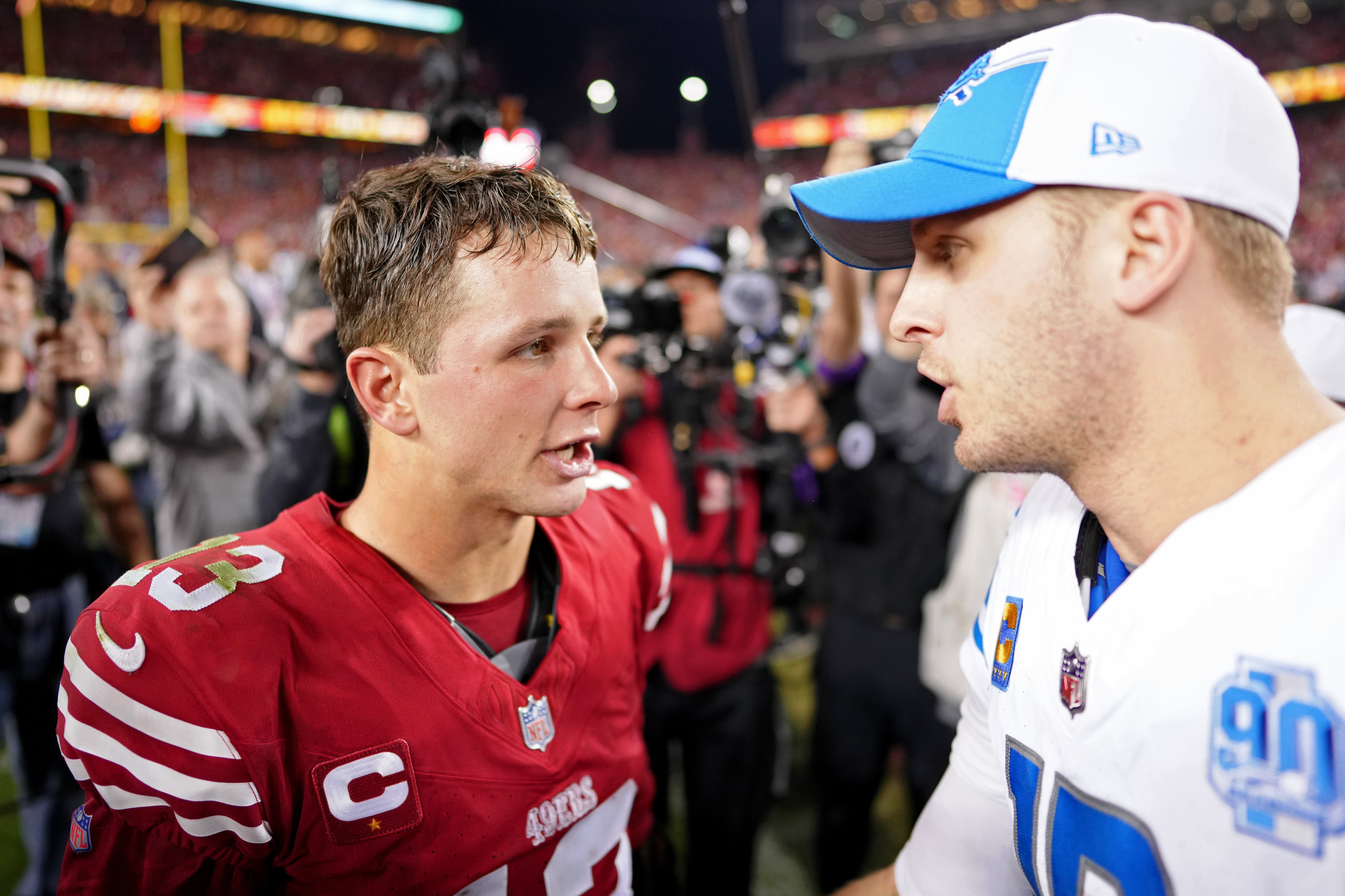 San Francisco 49ers quarterback Brock Purdy (13) talks with Detroit Lions quarterback Jared Goff (16) after the NFC Championship football game at Levi's Stadium.