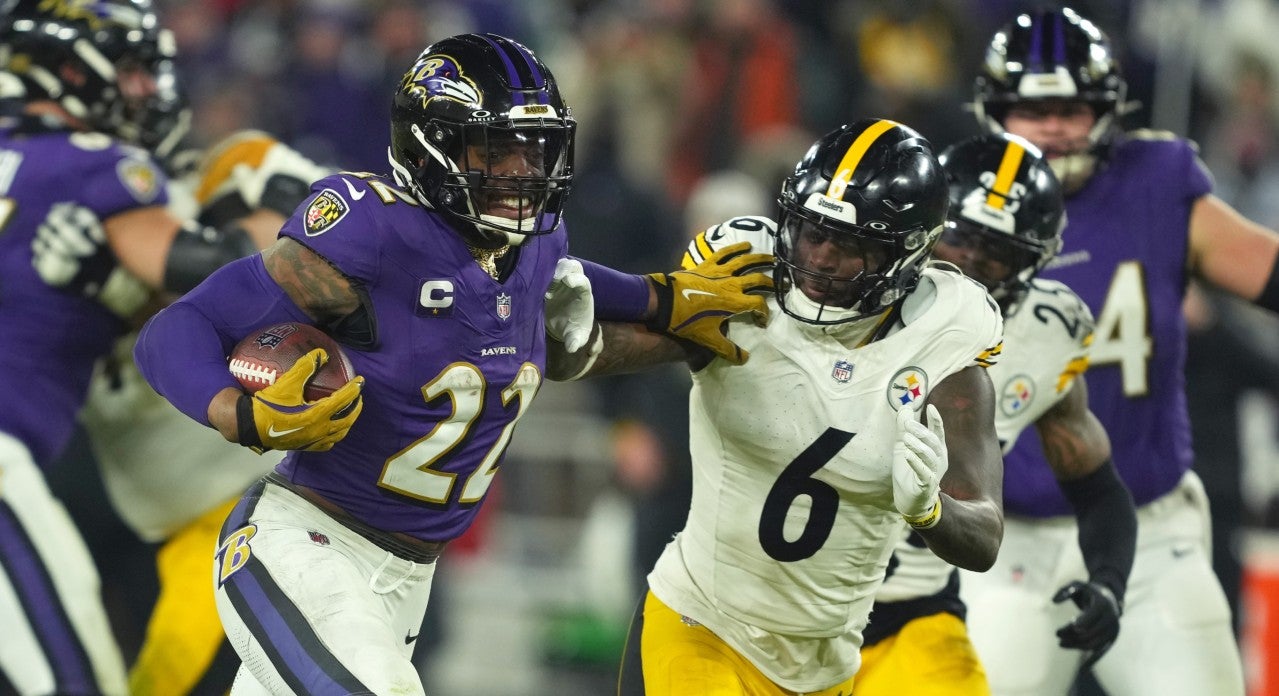 Jan 11, 2025; Baltimore, Maryland, USA; Baltimore Ravens running back Derrick Henry (22) runs to score a touchdown against Pittsburgh Steelers linebacker Patrick Queen (6) in the third quarter in an AFC wild card game at M&T Bank Stadium.