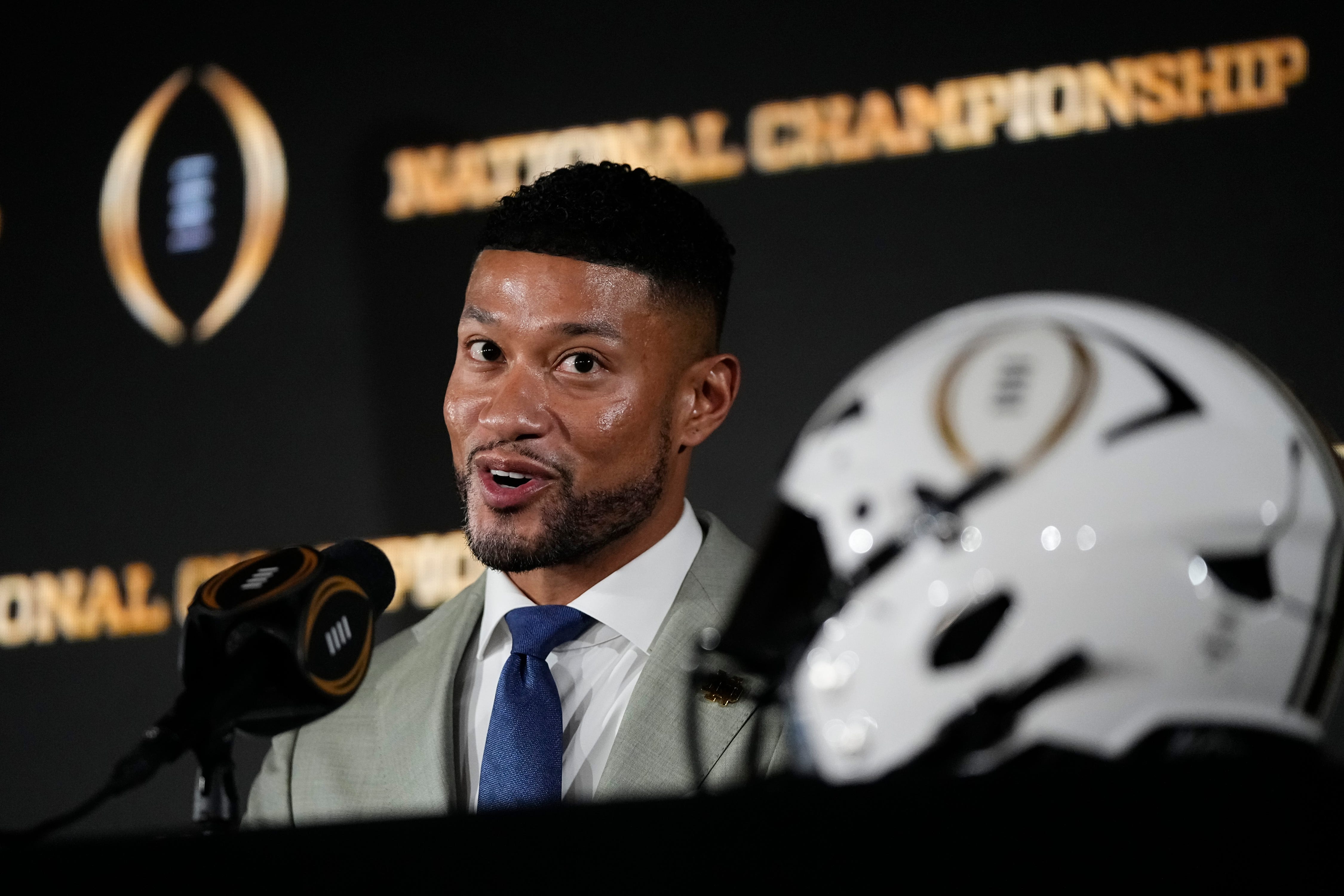 Notre Dame Fighting Irish head coach Marcus Freeman speaks during a press conference with Ohio State Buckeyes head coach Ryan Day prior to their College Football Playoff championship matchup in Atlanta on Jan. 19, 2025.