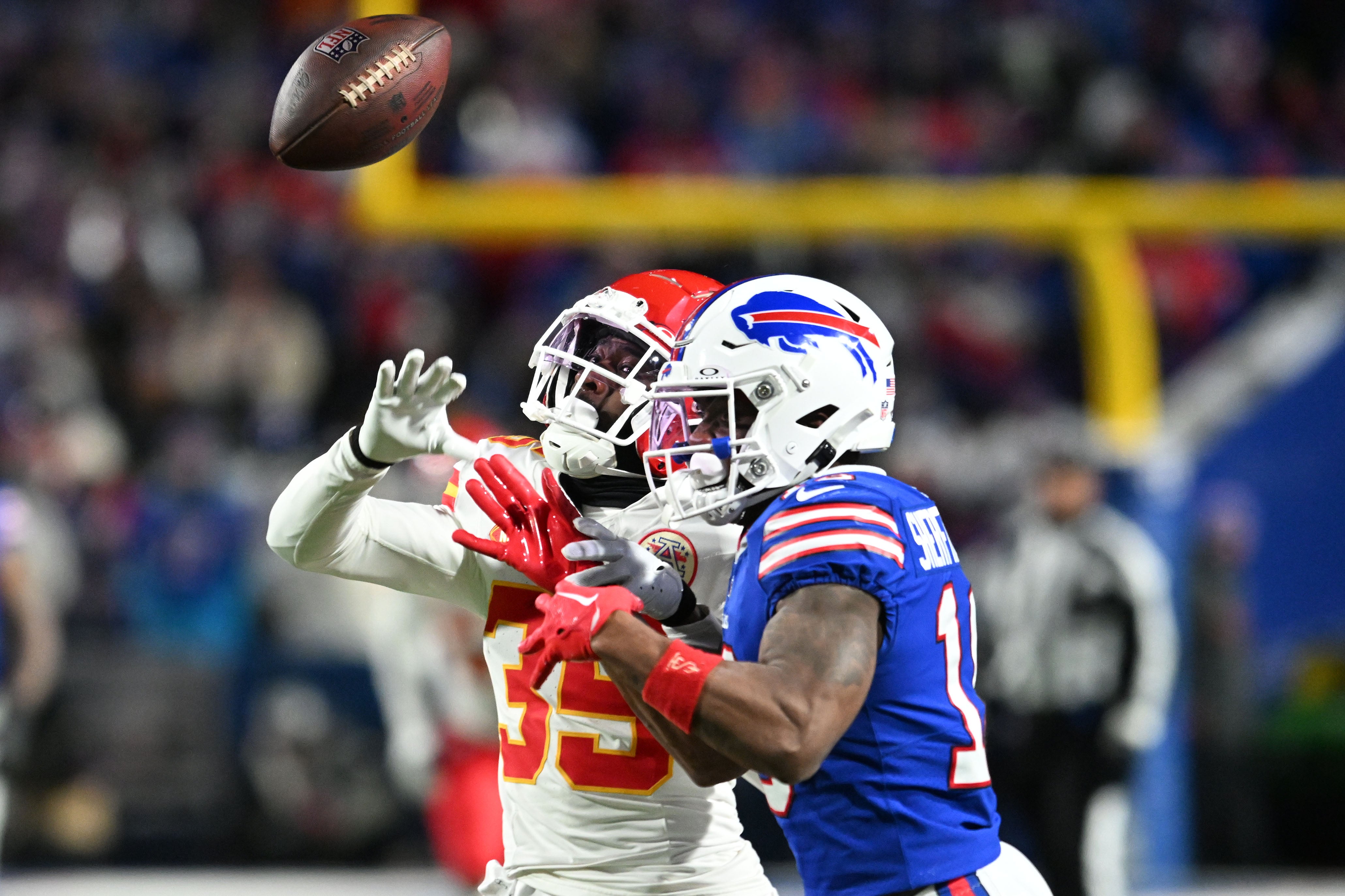 Jan 21, 2024; Orchard Park, New York, USA; Kansas City Chiefs cornerback Jaylen Watson (35) breaks up a pass for Buffalo Bills wide receiver Trent Sherfield (16) in the first half of the 2024 AFC divisional round game at Highmark Stadium.
