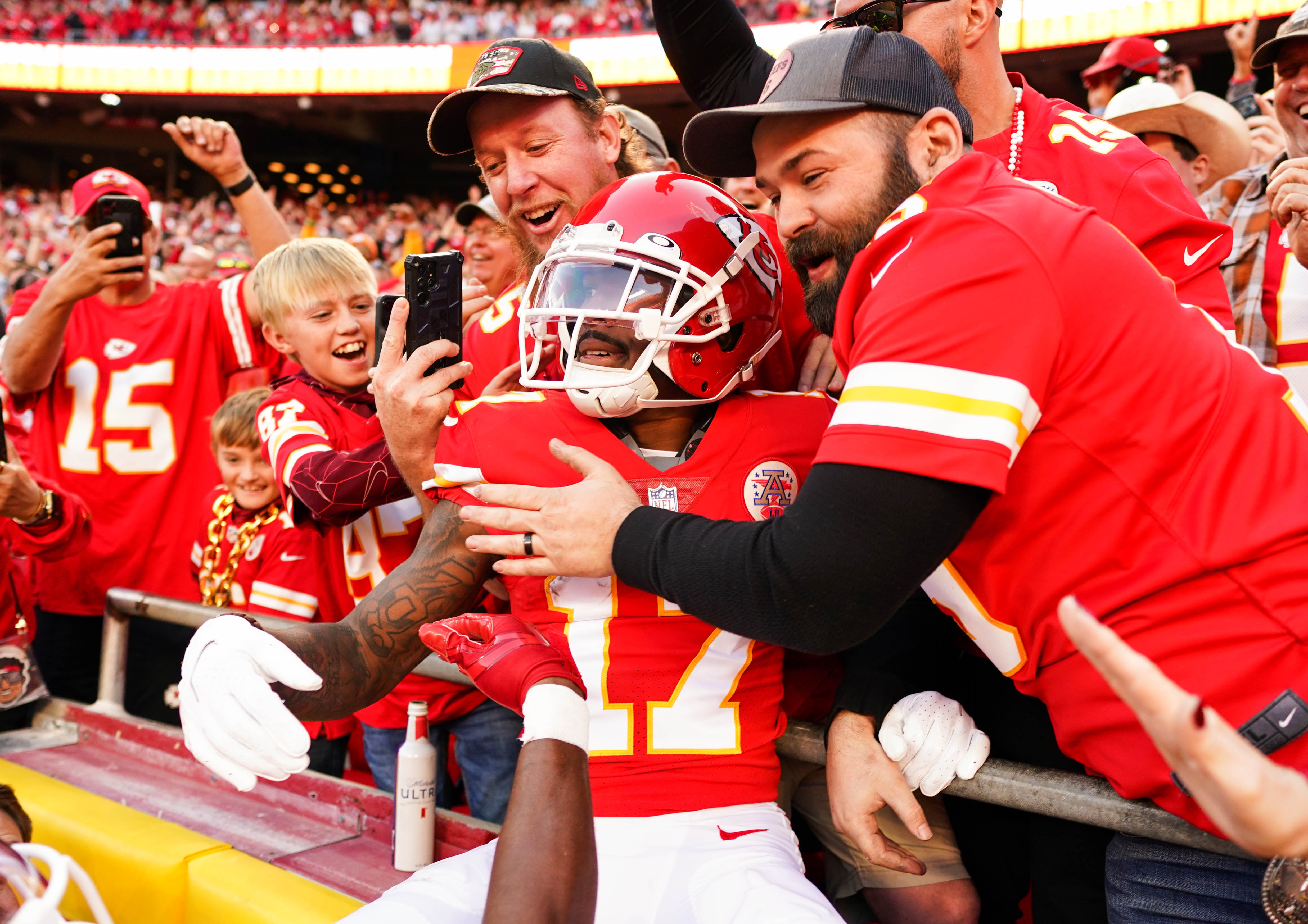 Oct 16, 2022; Kansas City, Missouri, USA; Kansas City Chiefs wide receiver Mecole Hardman (17) celebrates with fans after scoring a touchdown during the second half against the Buffalo Bills at GEHA Field at Arrowhead Stadium.