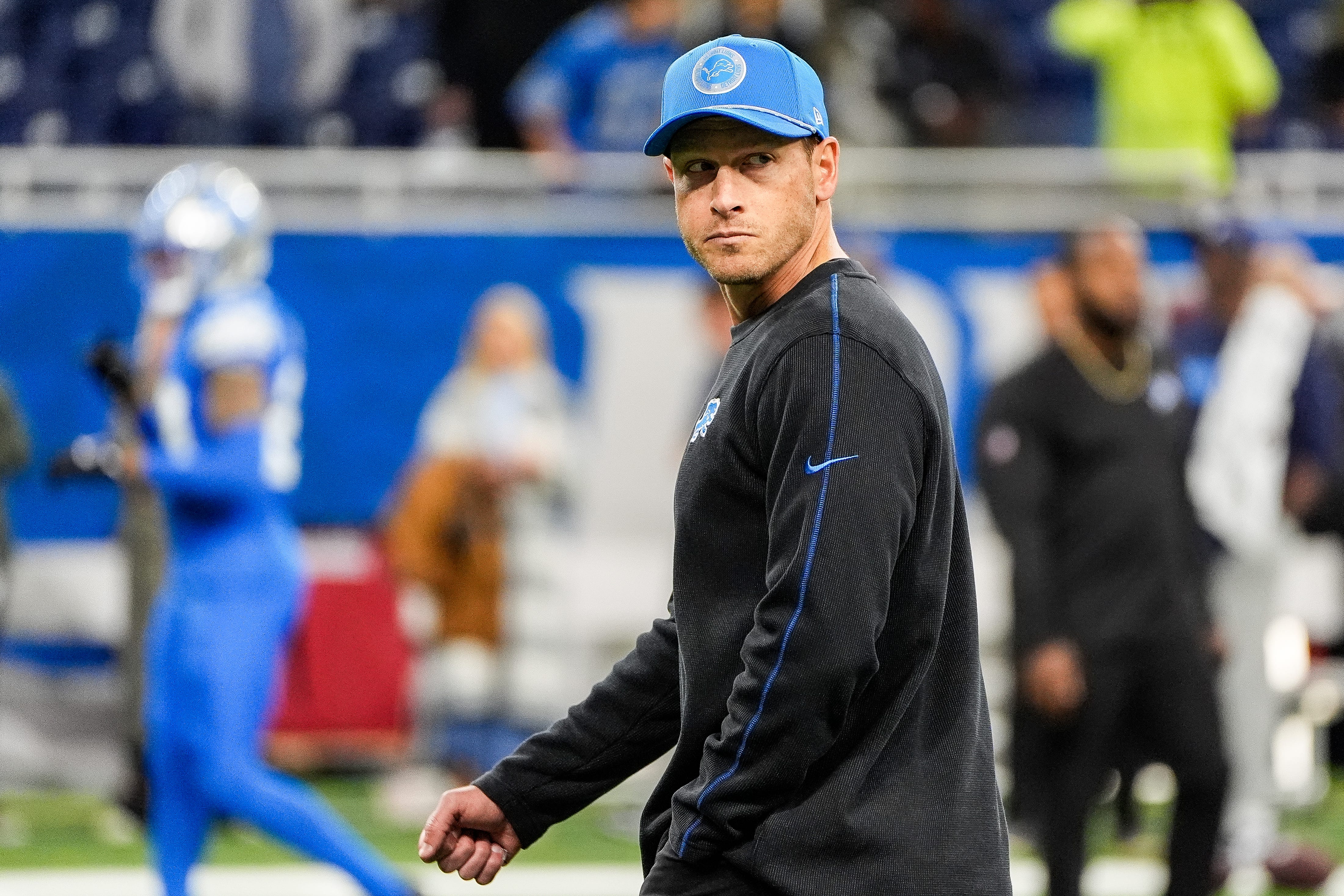 Detroit Lions offensive coordinator Ben Johnson watches warm up before the Tennessee Titans game at Ford Field in Detroit on Sunday, Oct. 27, 2024.