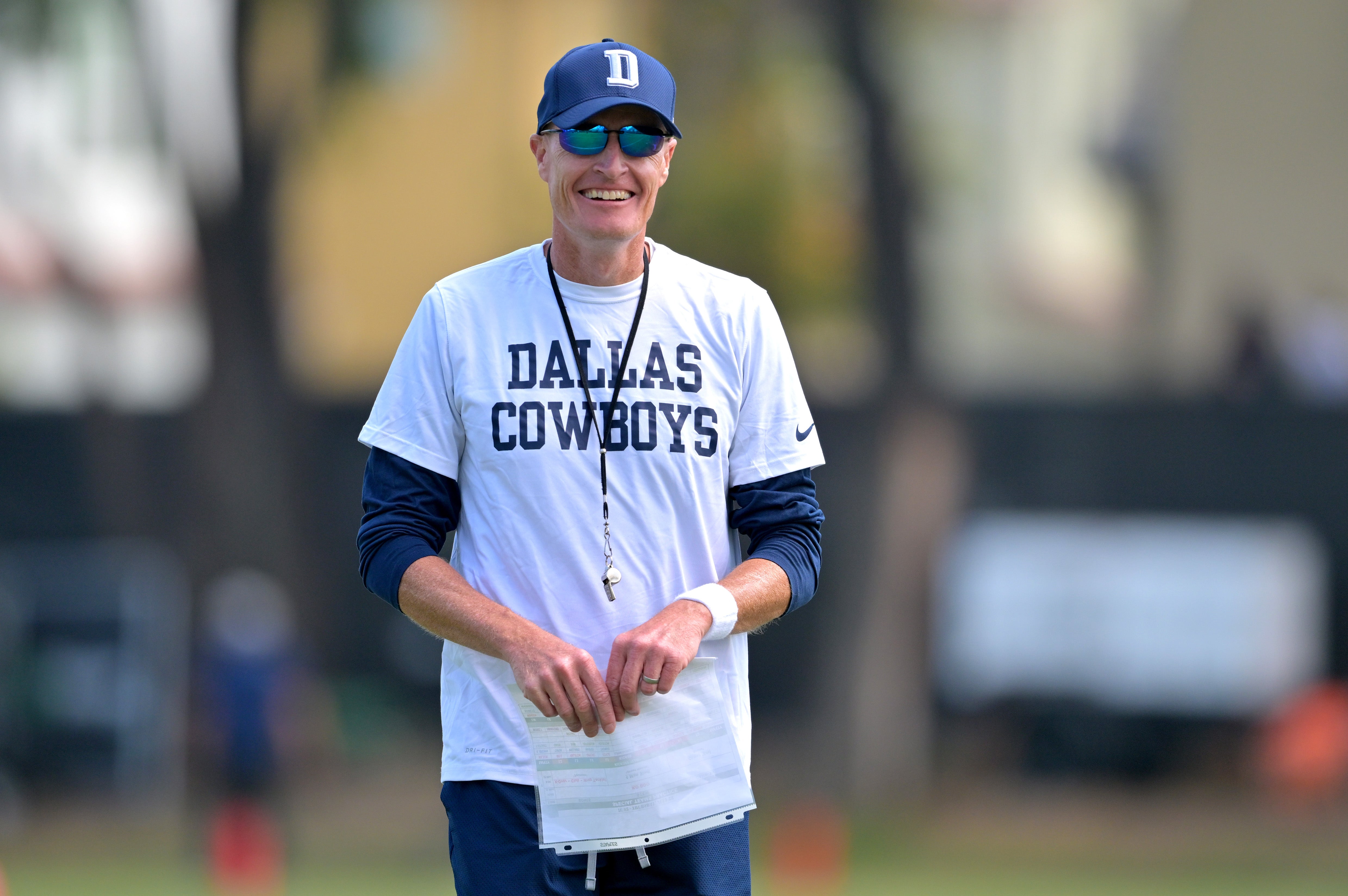 Dallas Cowboys special teams coordinator John Fassel runs drills at training camp at River Ridge Fields in Oxnard, CA. Jayne Kamin-Oncea-Imagn Images