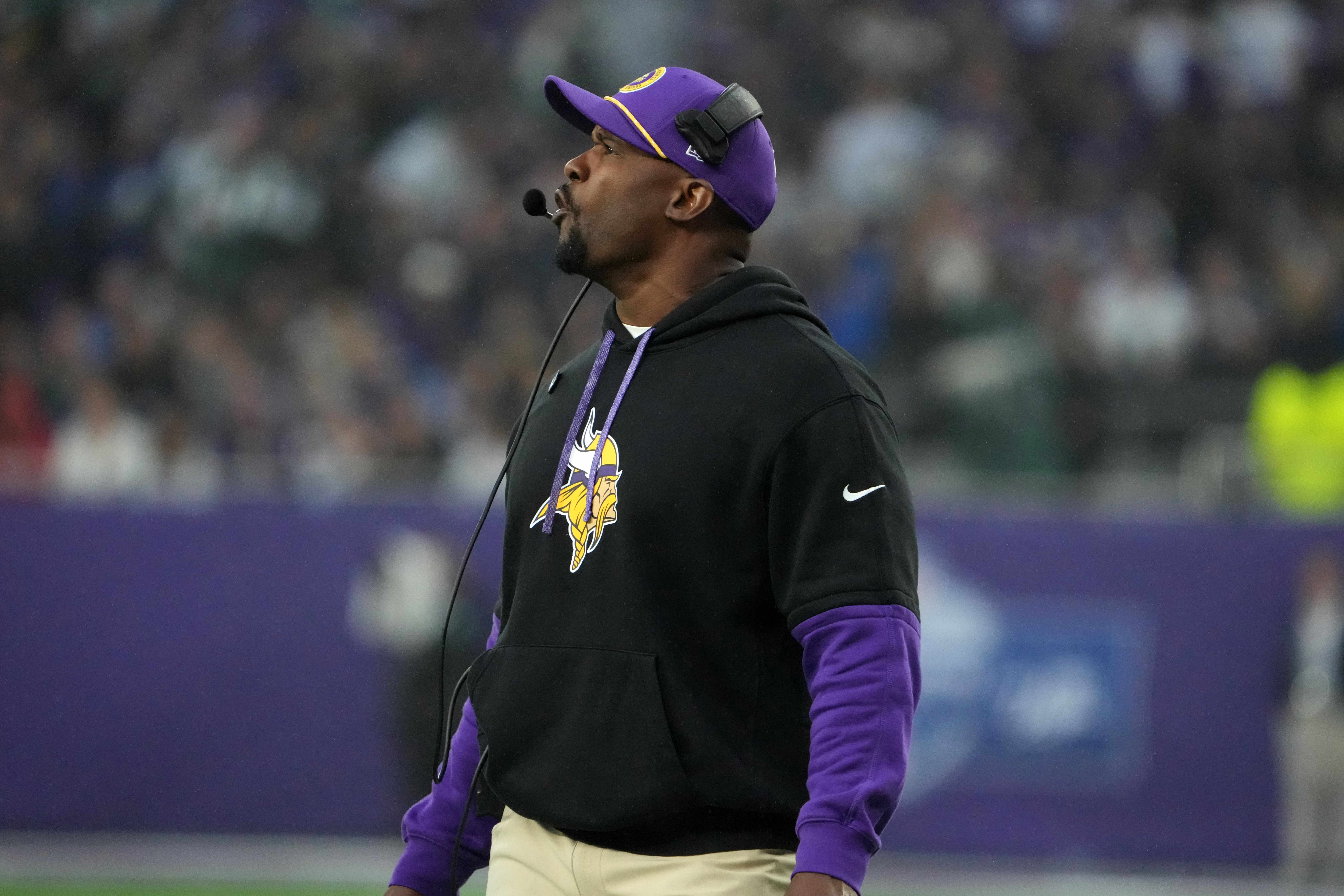 Oct 6, 2024; London, United Kingdom; Minnesota Vikings defensive coordinator Brian Flores watches from the sidelines against the New York Jets in the second half at Tottenham Hotspur Stadium.