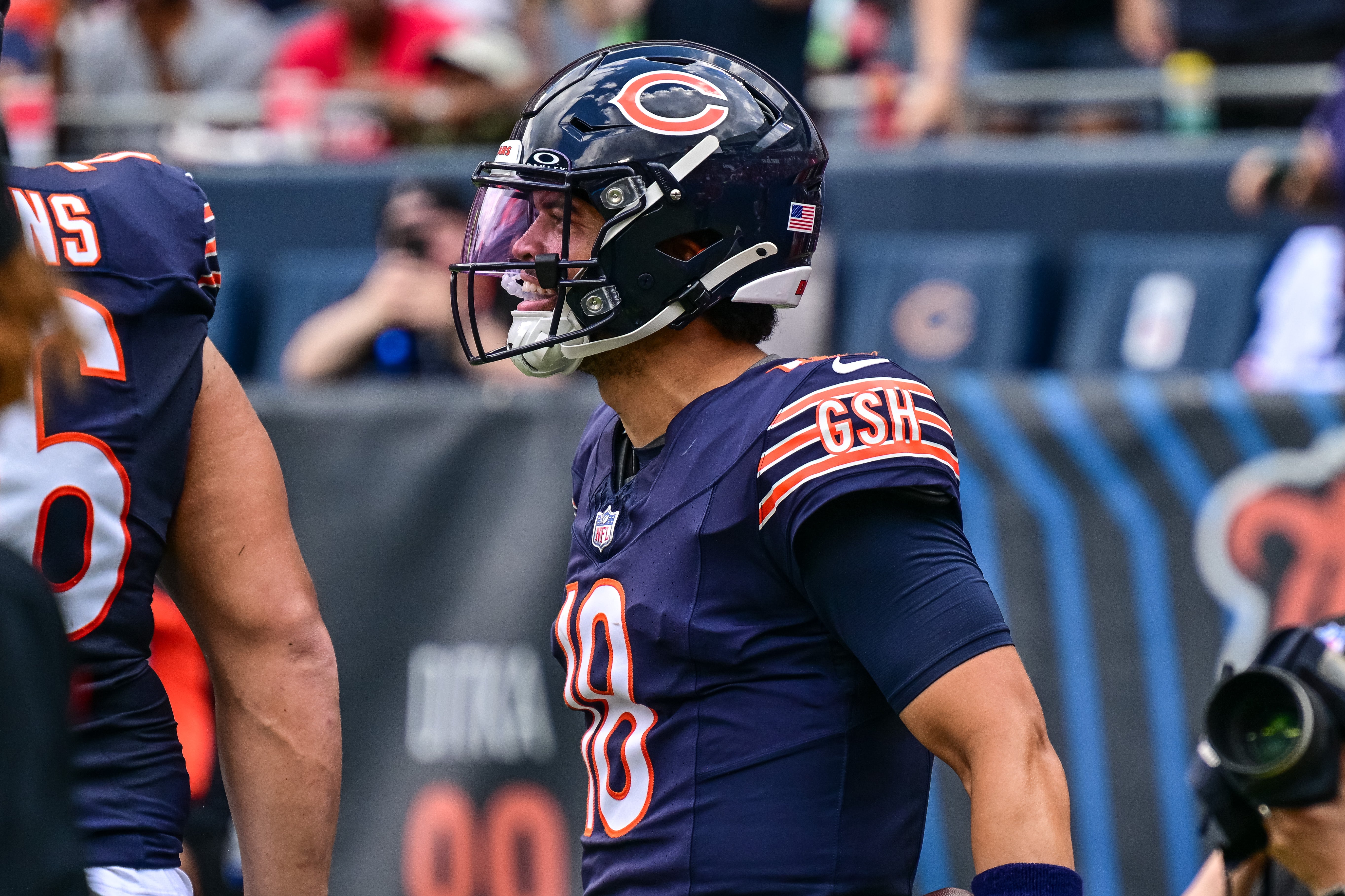 Aug 17, 2024; Chicago, Illinois, USA; Chicago Bears quarterback Caleb Williams (18) celebrates his rushing touchdown against the Cincinnati Bengals during the second quarter at Soldier Field.