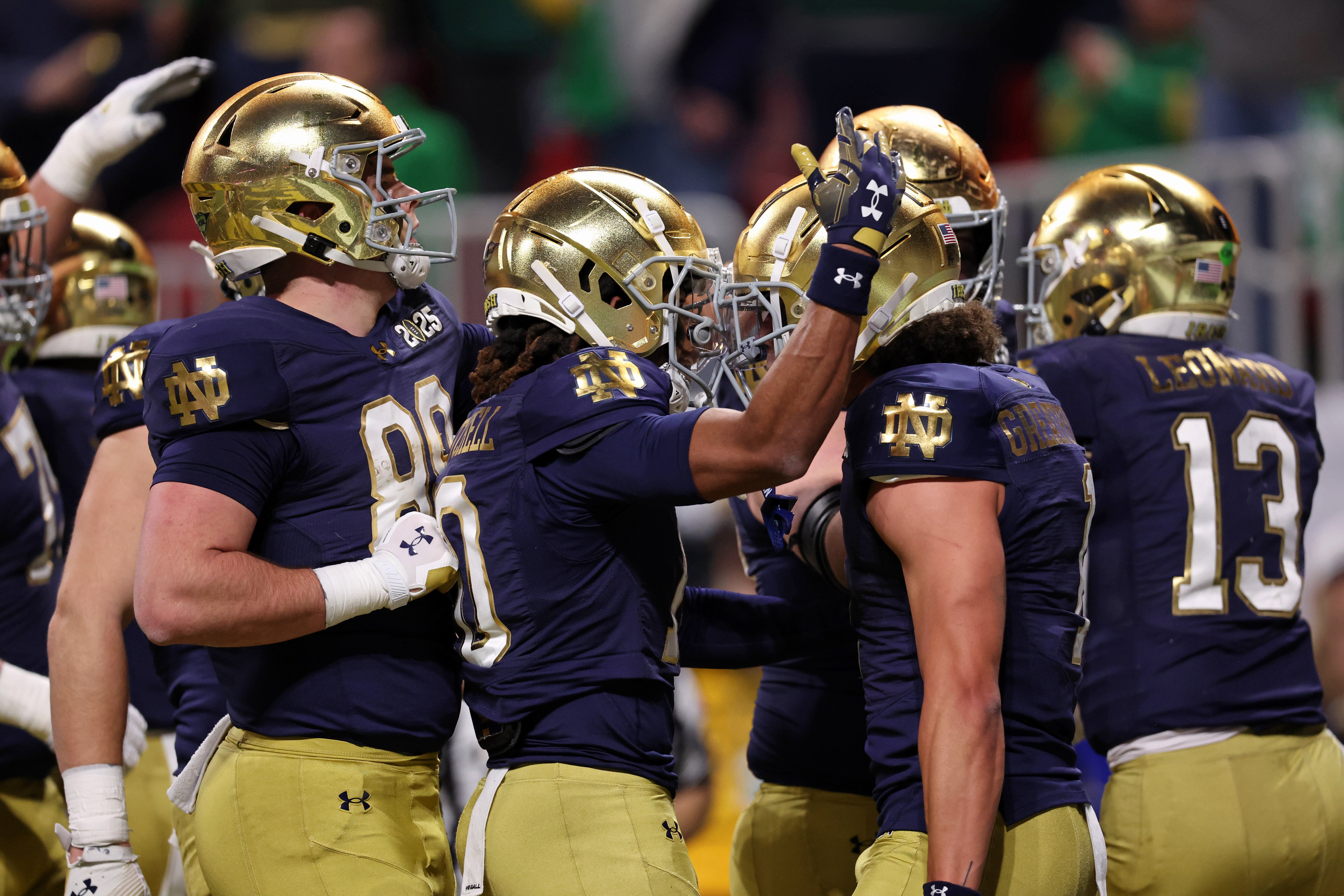 Notre Dame Fighting Irish celebrate a touchdown against the Ohio State Buckeyes by wide receiver Jaden Greathouse (1) during the second half the CFP National Championship college football game at Mercedes-Benz Stadium.