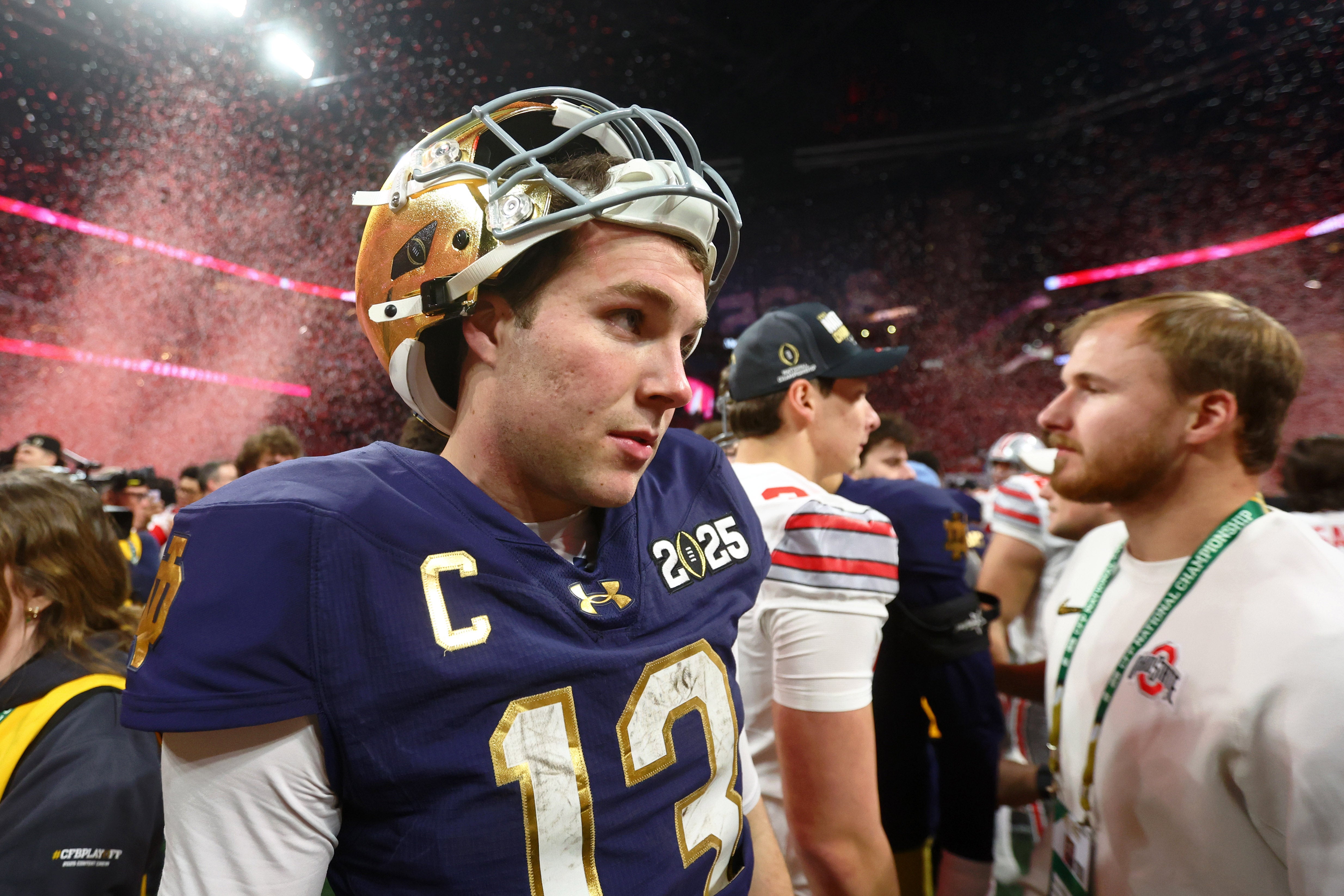 Notre Dame Fighting Irish quarterback Riley Leonard (13) reacts after losing the CFP National Championship college football game at Mercedes-Benz Stadium.