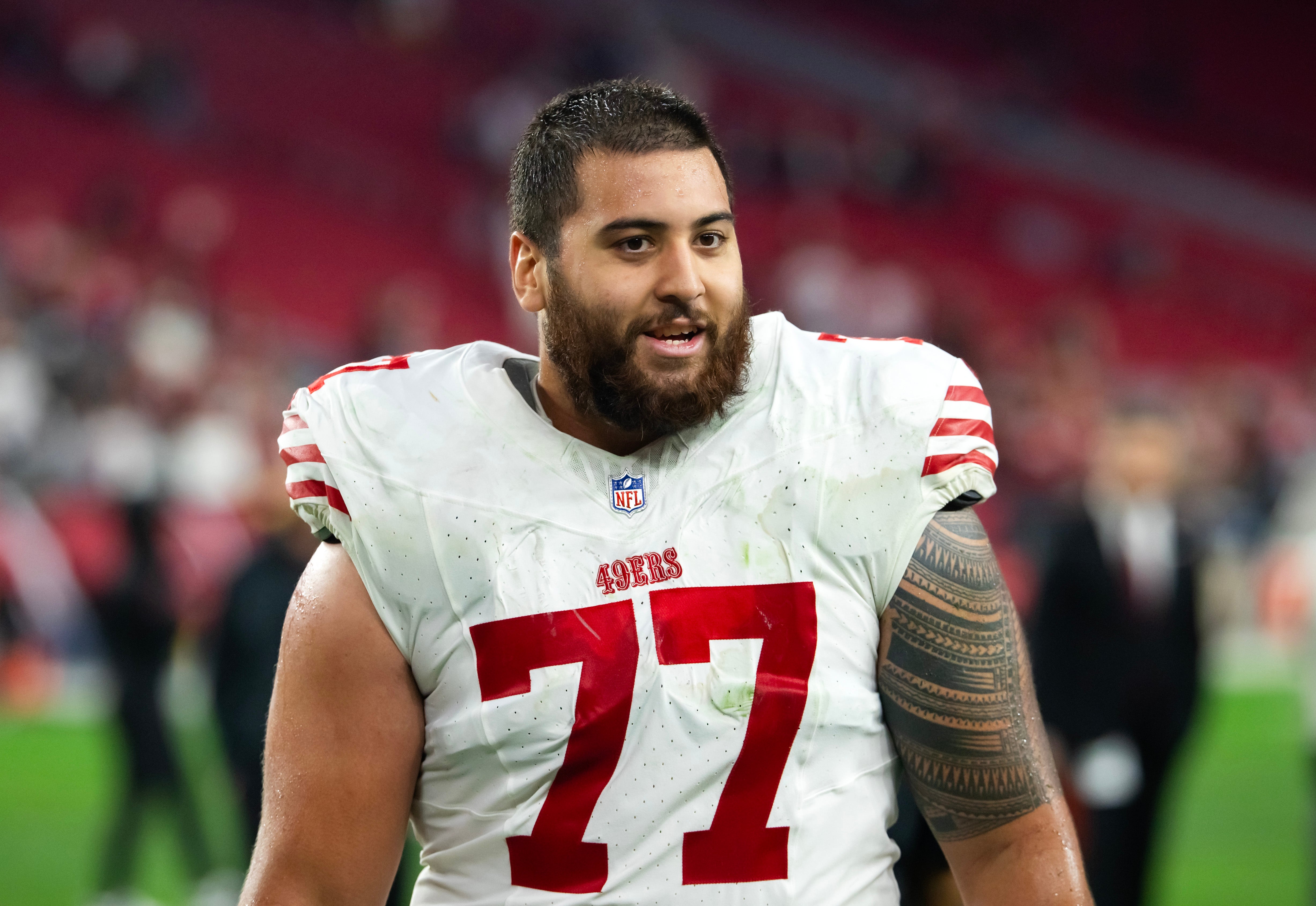 San Francisco 49ers guard Dominick Puni (77) against the Arizona Cardinals at State Farm Stadium.