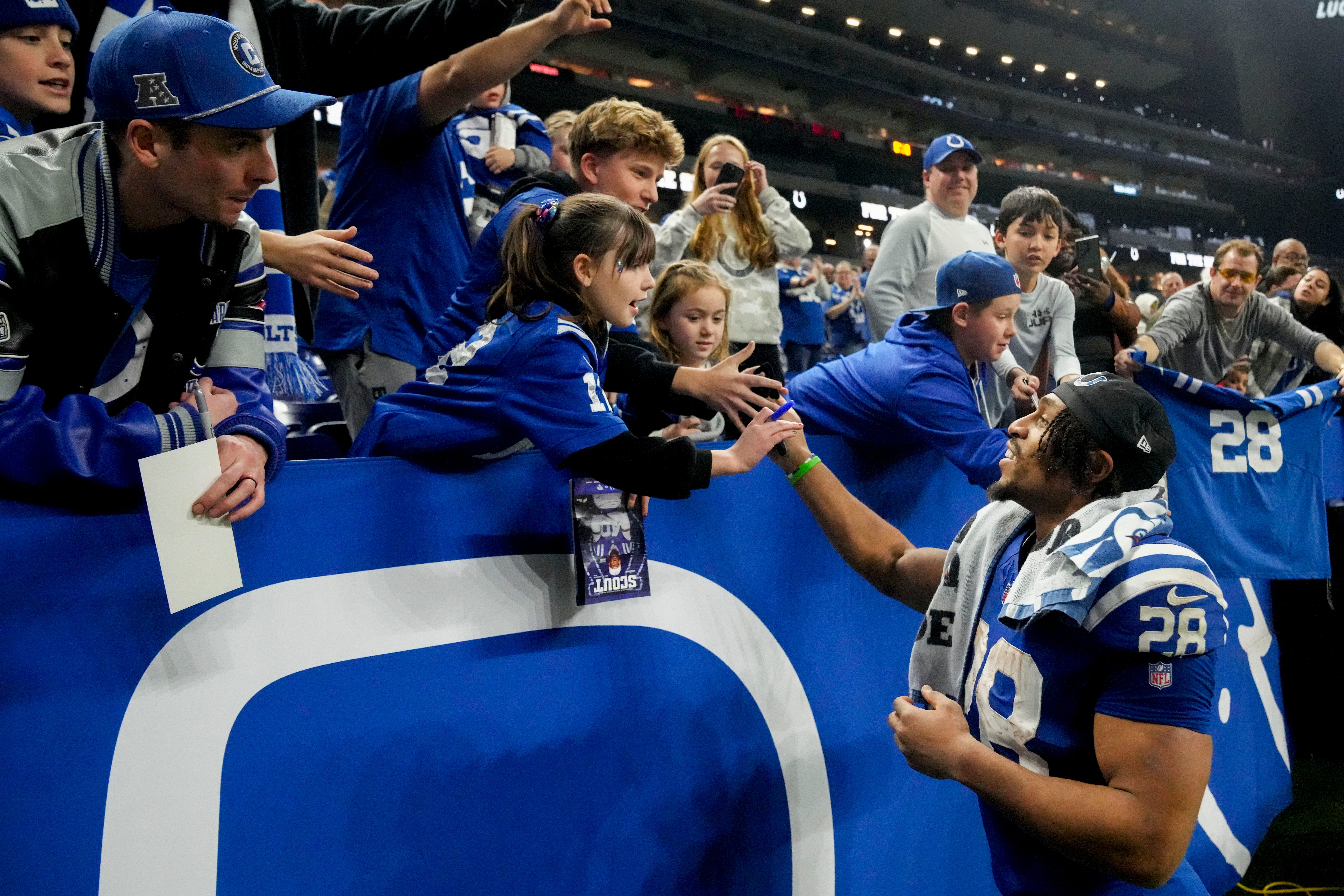 Indianapolis Colts running back Jonathan Taylor (28) greets fans Sunday, Jan. 5, 2025, after defeating the Jacksonville Jaguars 26-23 in overtime at Lucas Oil Stadium in Indianapolis.