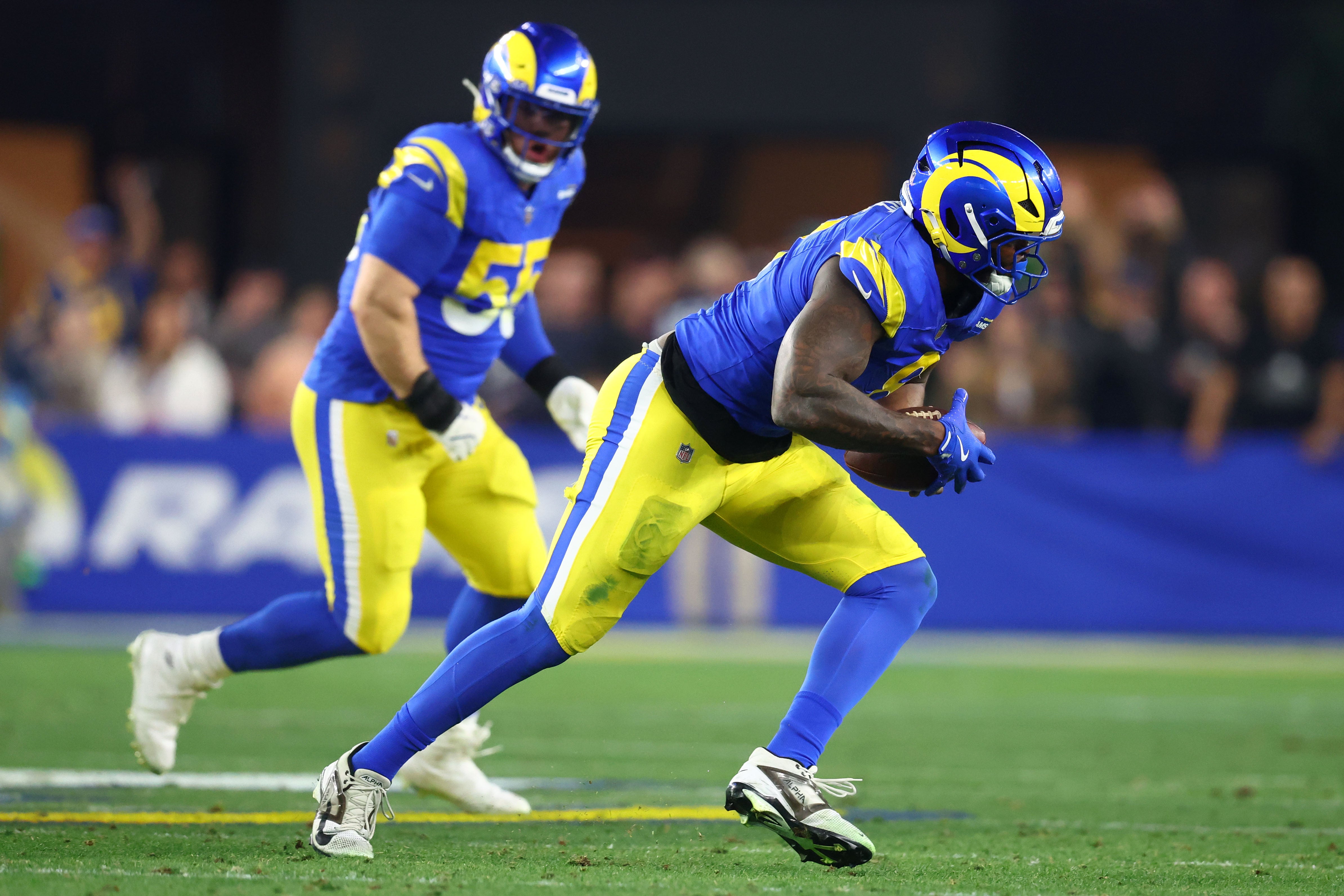 Rams linebacker Jared Verse (8) recovers a fumble against the Vikings.