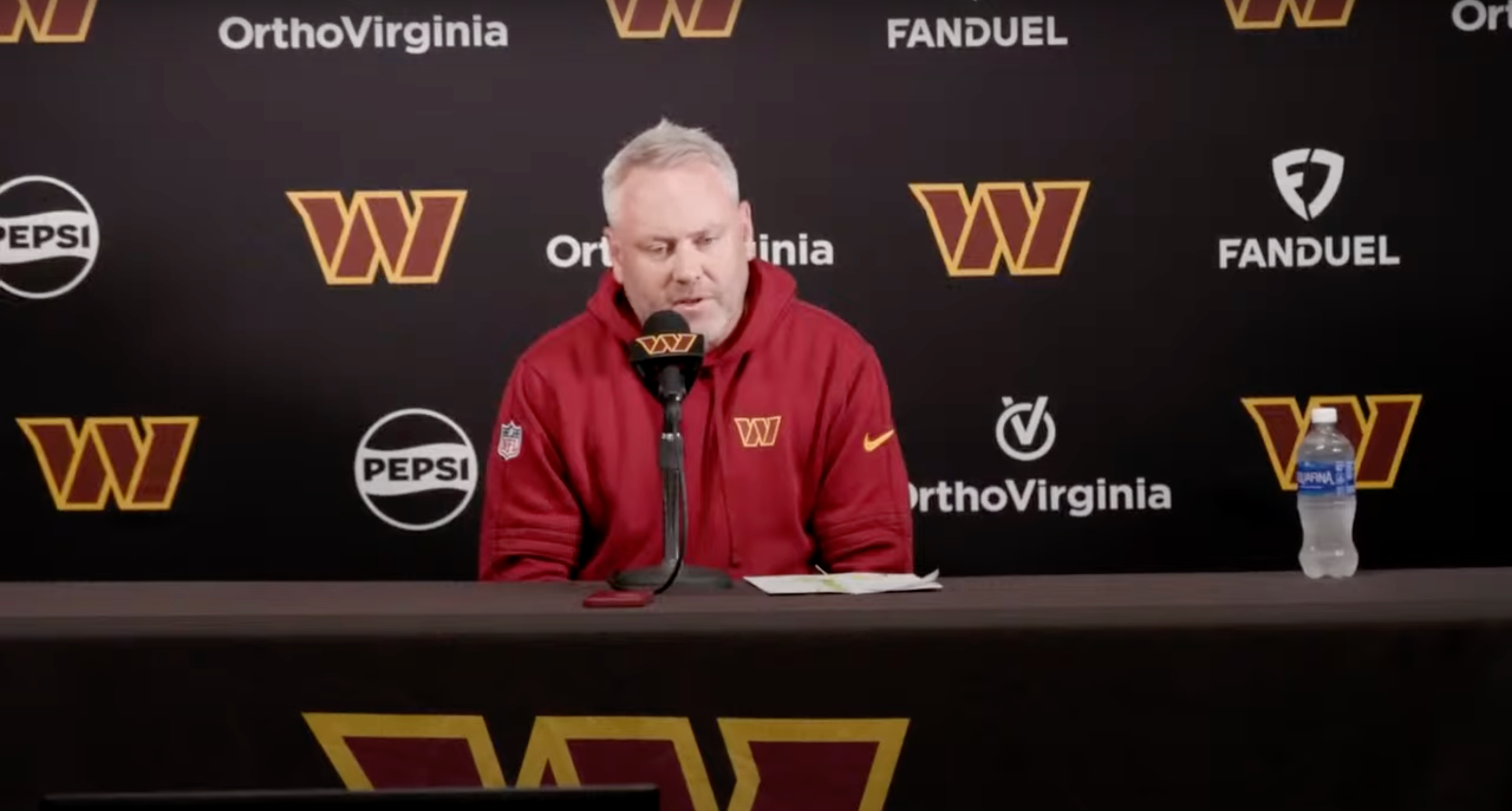 Commanders assistant general manager Lance Newmark talks with reporters in August 2024.