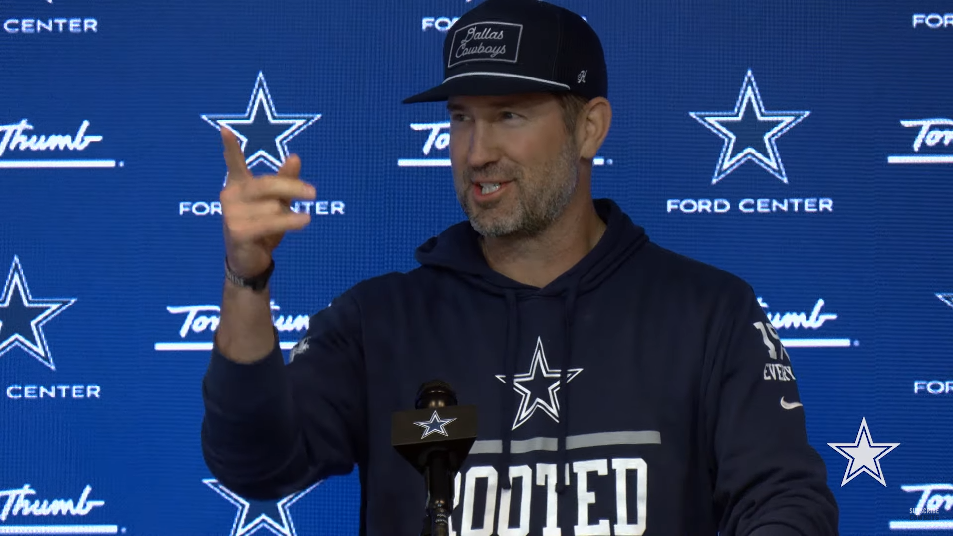 Dallas Cowboys' Brian Schottenheimer talks to reporters toward end of 2024 regular season.