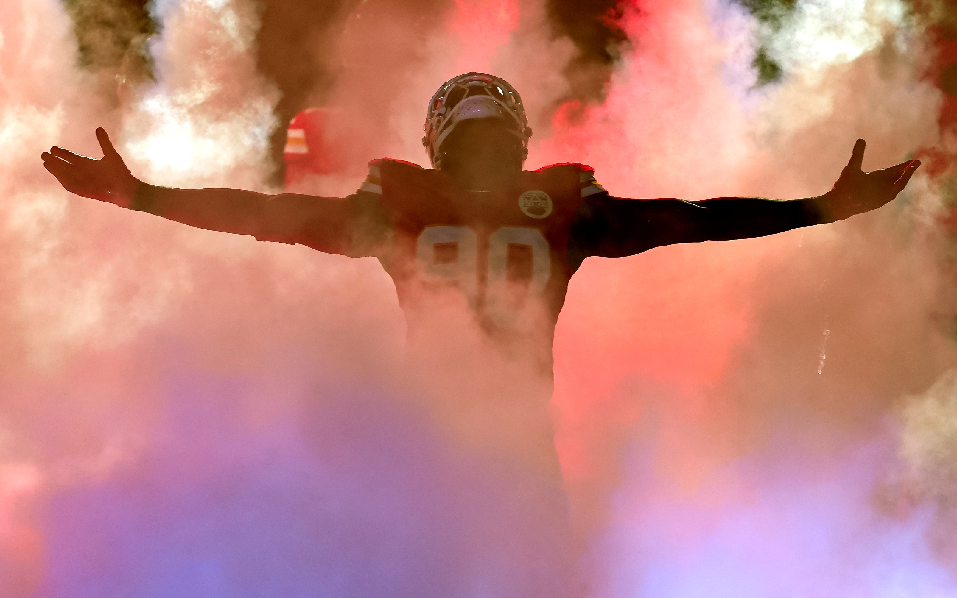Kansas City Chiefs defensive end Charles Omenihu (90) is introduced prior to a game against the Los Angeles Chargers at GEHA Field at Arrowhead Stadium.