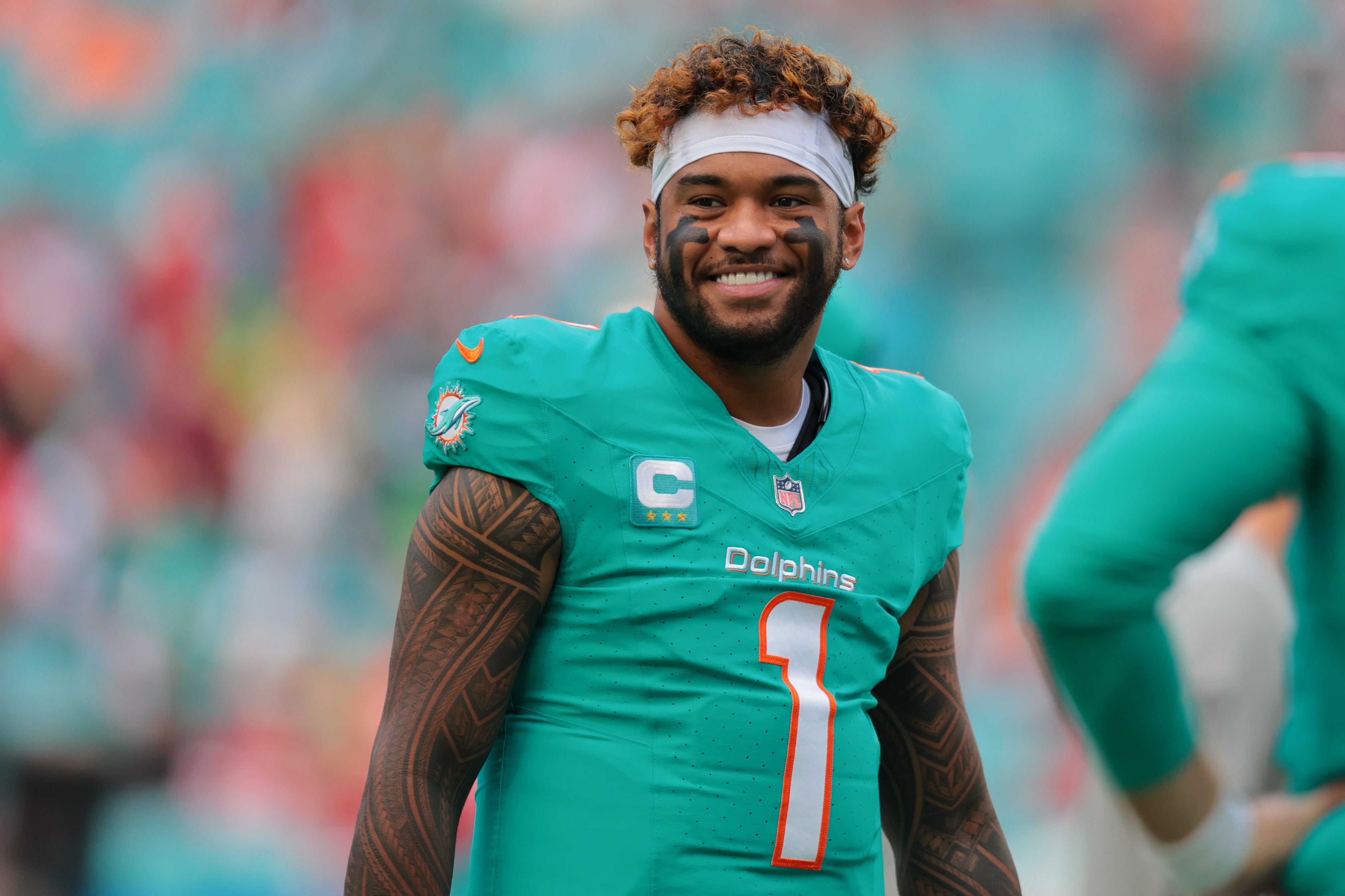 Dec 22, 2024; Miami Gardens, Florida, USA; Miami Dolphins quarterback Tua Tagovailoa (1) looks on before the game against the San Francisco 49ers at Hard Rock Stadium.