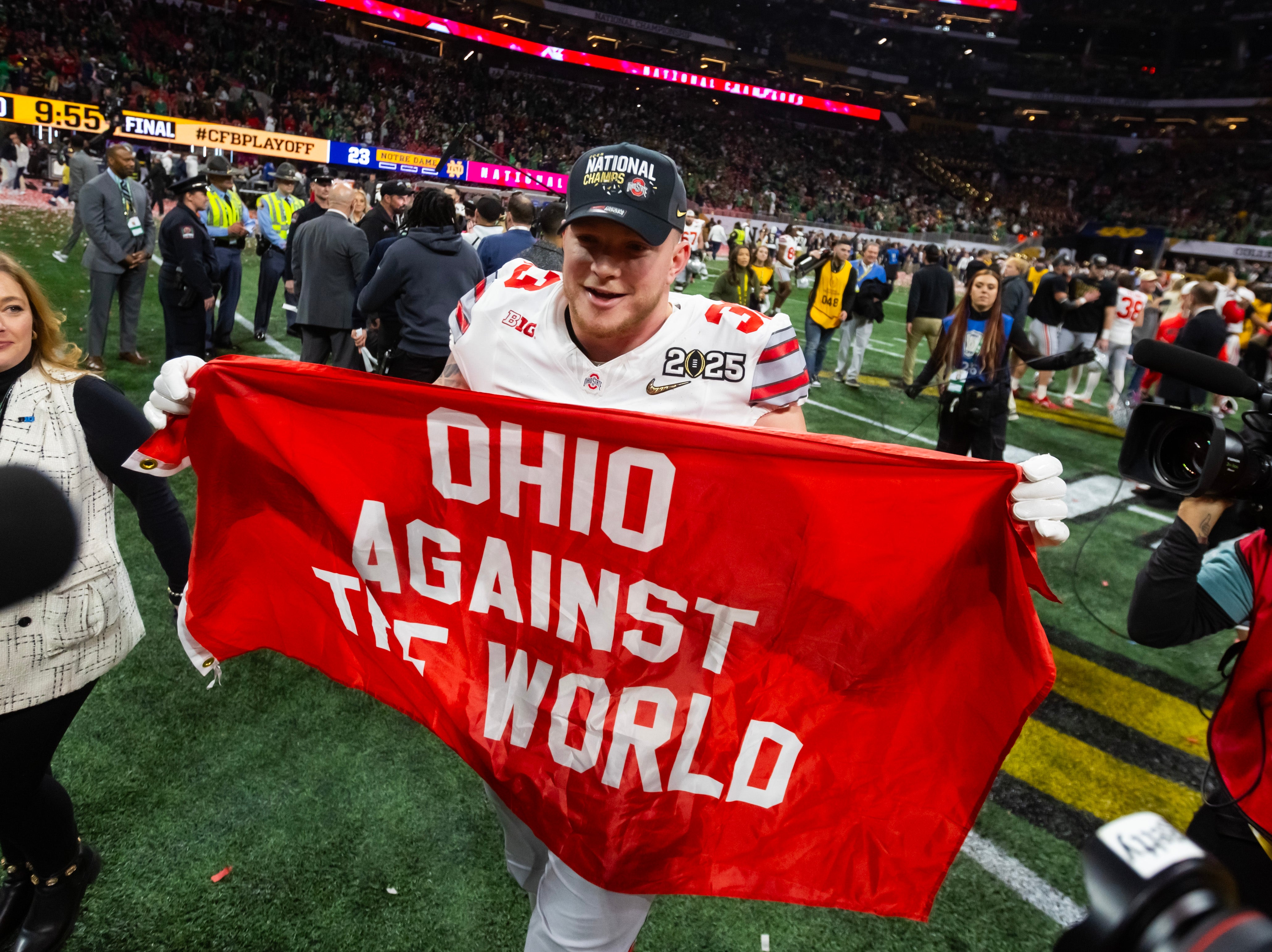 Jan 20, 2025; Atlanta, GA, USA; Ohio State Buckeyes defensive end Jack Sawyer (33) celebrates after defeating the Notre Dame Fighting Irish in the CFP National Championship college football game at Mercedes-Benz Stadium.