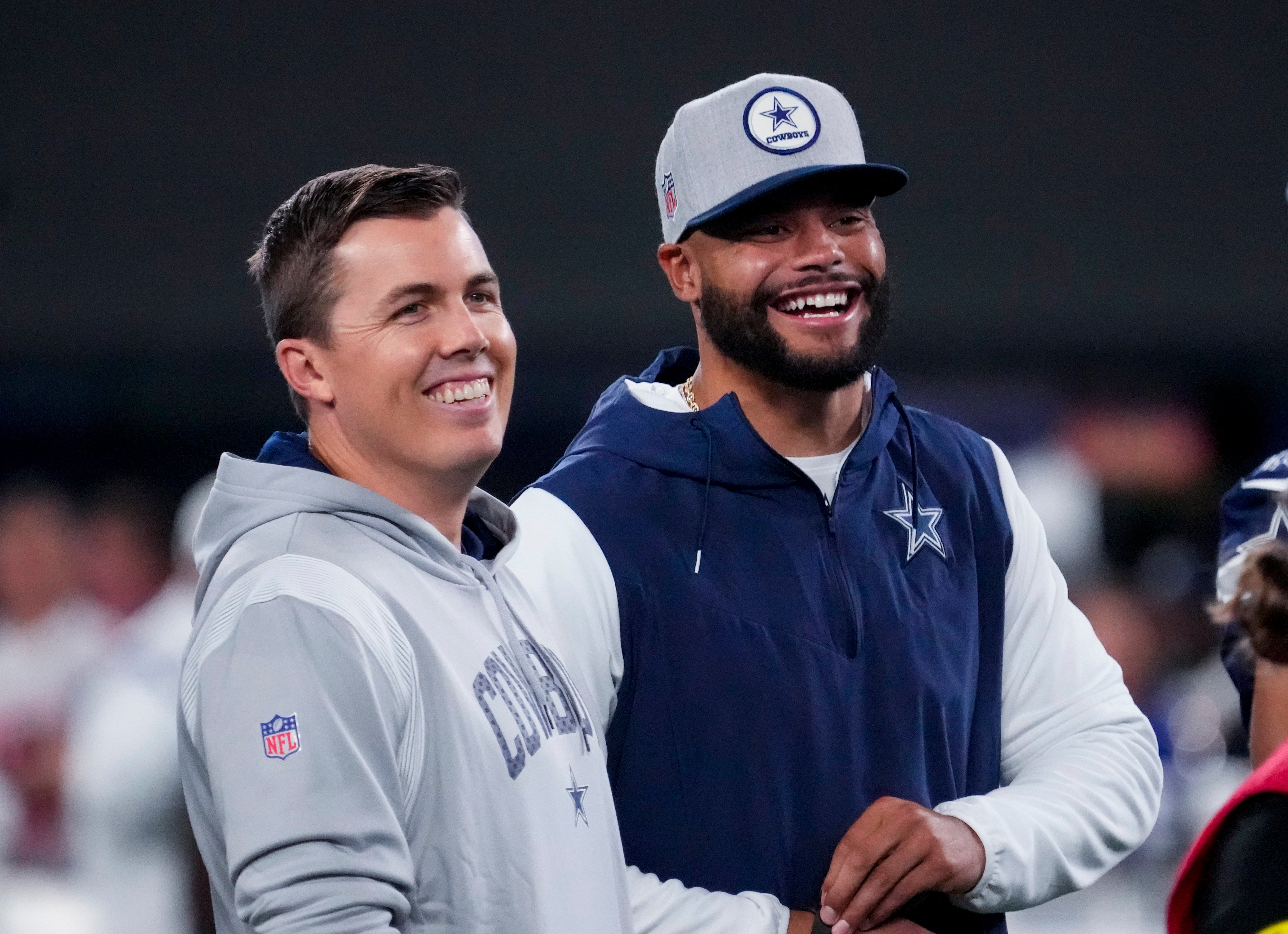 Dallas Cowboys quarterback Dak Prescott (right) laughs with offensive coordinator Kellen Moore before the game against the New York Giants at MetLife Stadium.