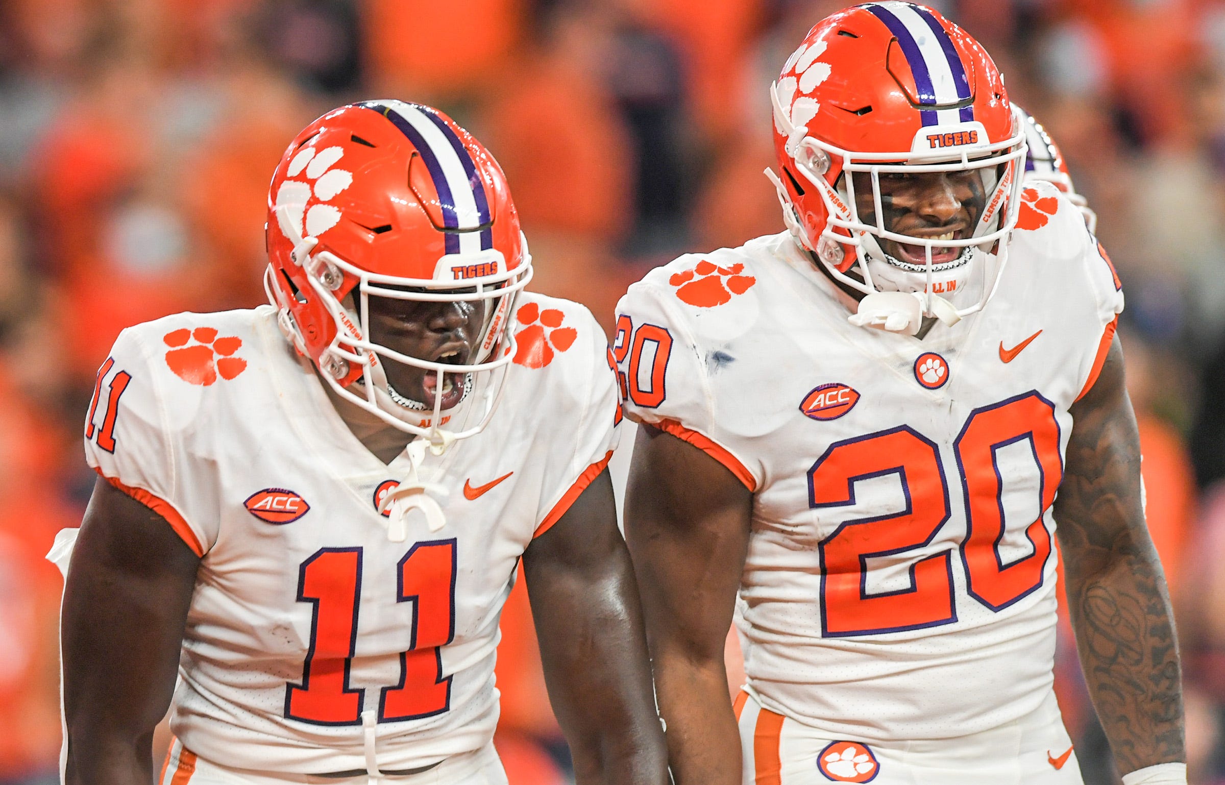 Clemson wide receiver Ajou Ajou (11) and running back Kobe Pace (20) react after the touchdown catch by wide receiver Joseph Ngata (10) during the second quarter at the Carrier Dome in Syracuse, New York, Friday, October 15, 2021. Ncaa Football Clemson At Syracuse