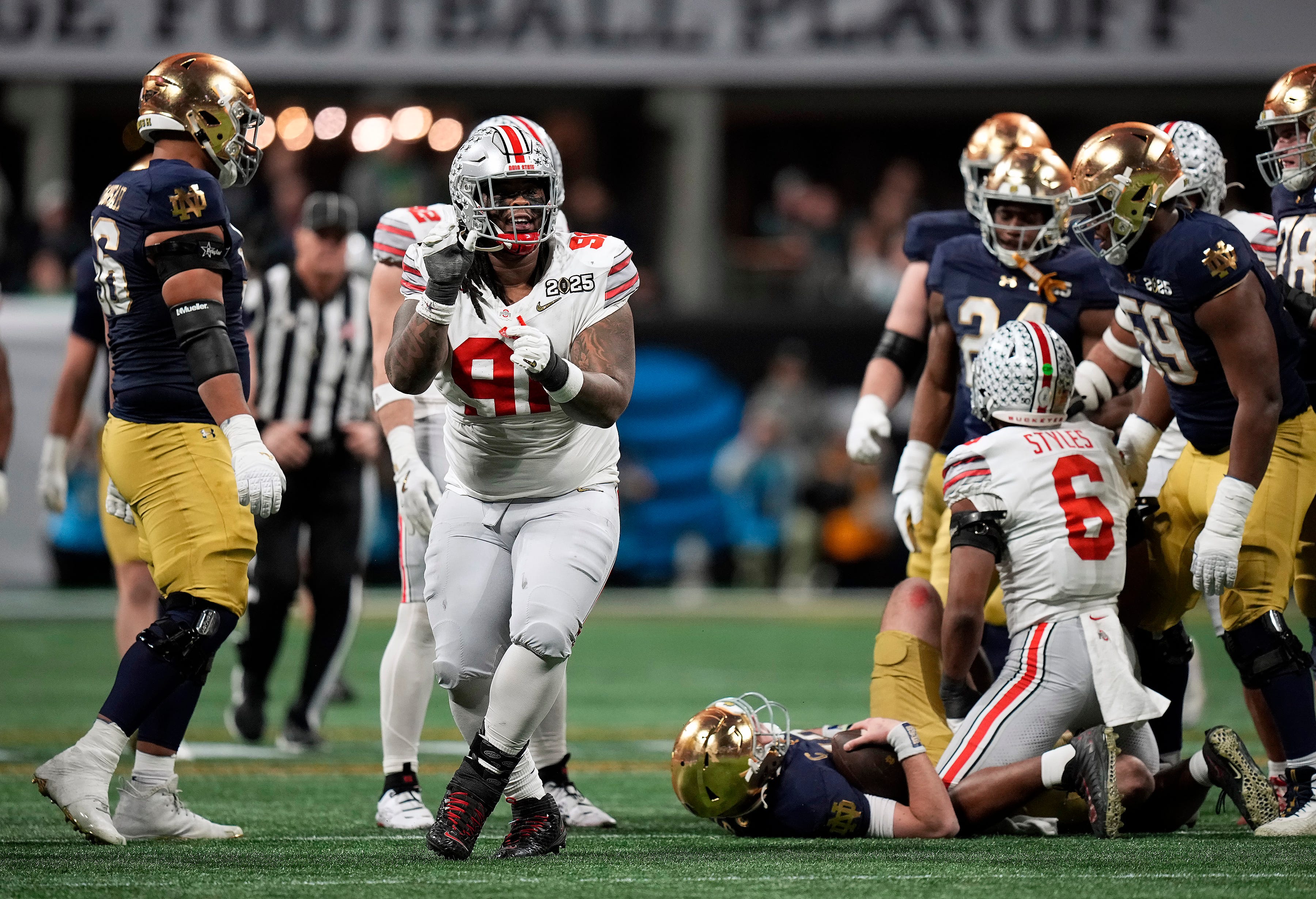 Ohio State Buckeyes defensive tackle Tyleik Williams (91) celebrates a sack against Notre Dame Fighting Irish in the third quarter during the College Football Playoff championship at Mercedes-Benz Stadium in Atlanta on January 20, 2025.