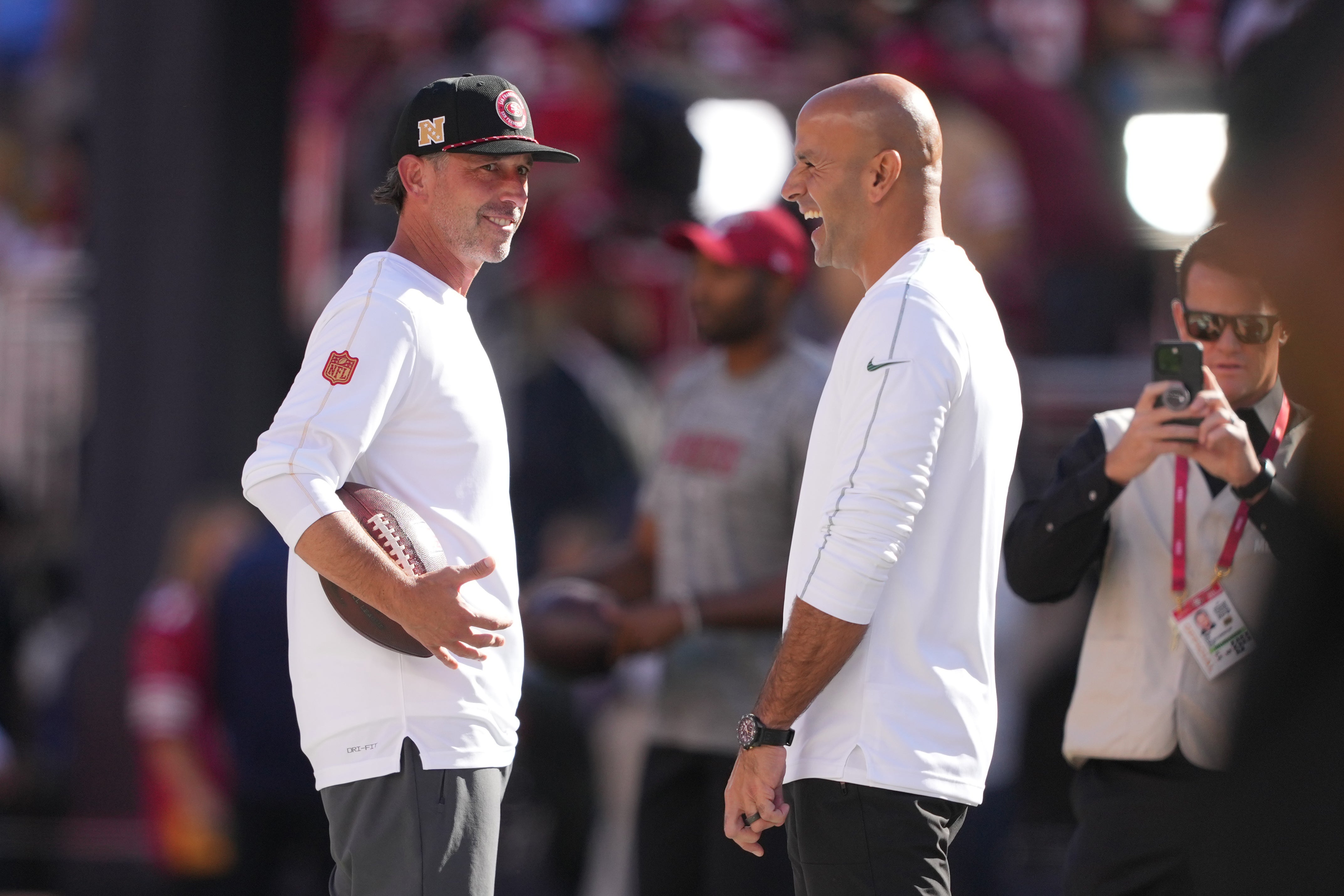 San Francisco 49ers head coach Kyle Shanahan (left) and New York Jets head coach Robert Saleh (right) talk before the game at Levi's Stadium.