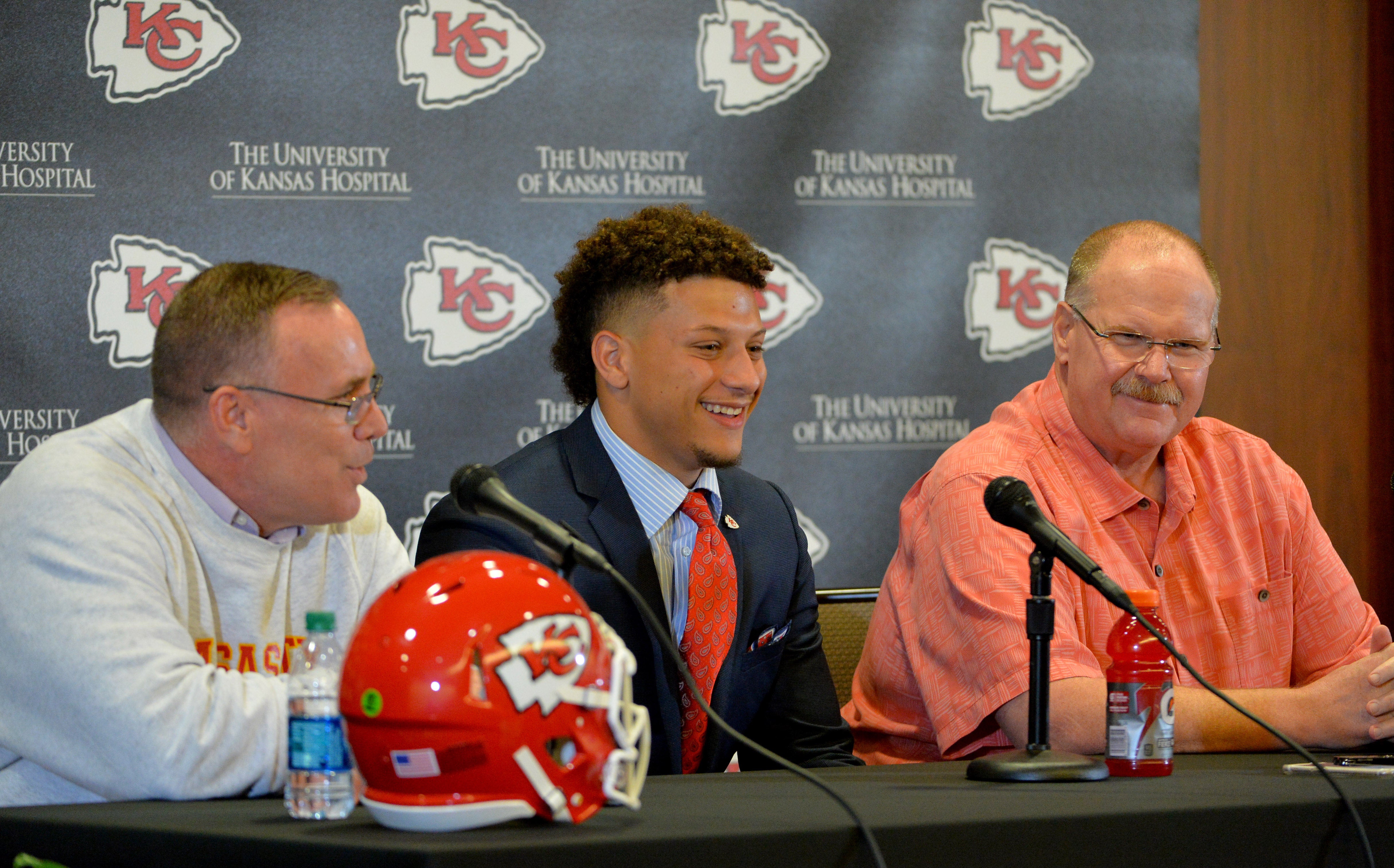 Apr 28, 2017; Kansas City, MO, USA; Kansas City Chiefs number 10 pick Patrick Mahomes II (middle), general manager John Dorsey (left) and head coach Andy Reid (right) speak with media during the press conference at Stram Theatre.